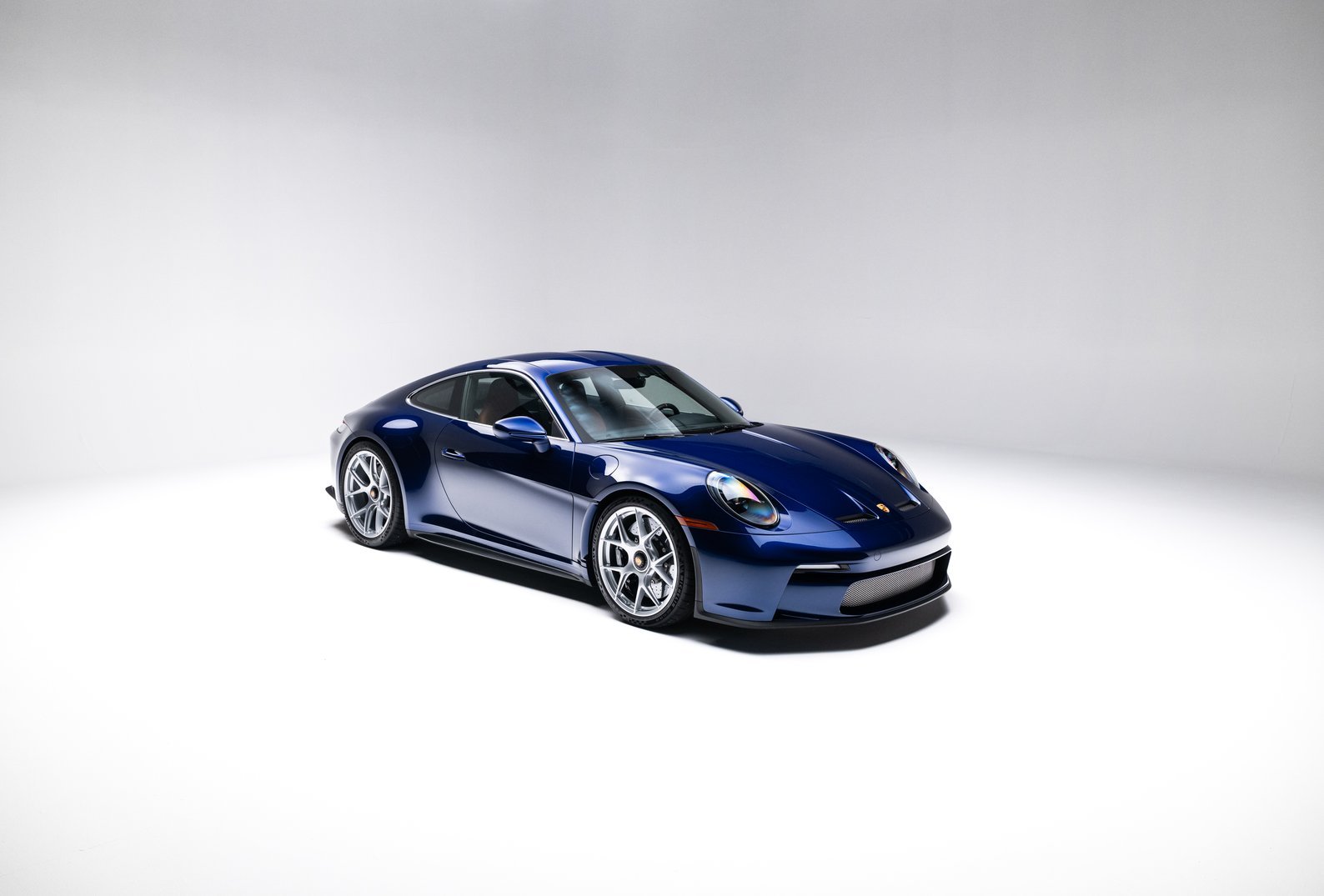 2024 Porsche 911 S/T in Gentian Blue Metallic, front three-quarter studio view