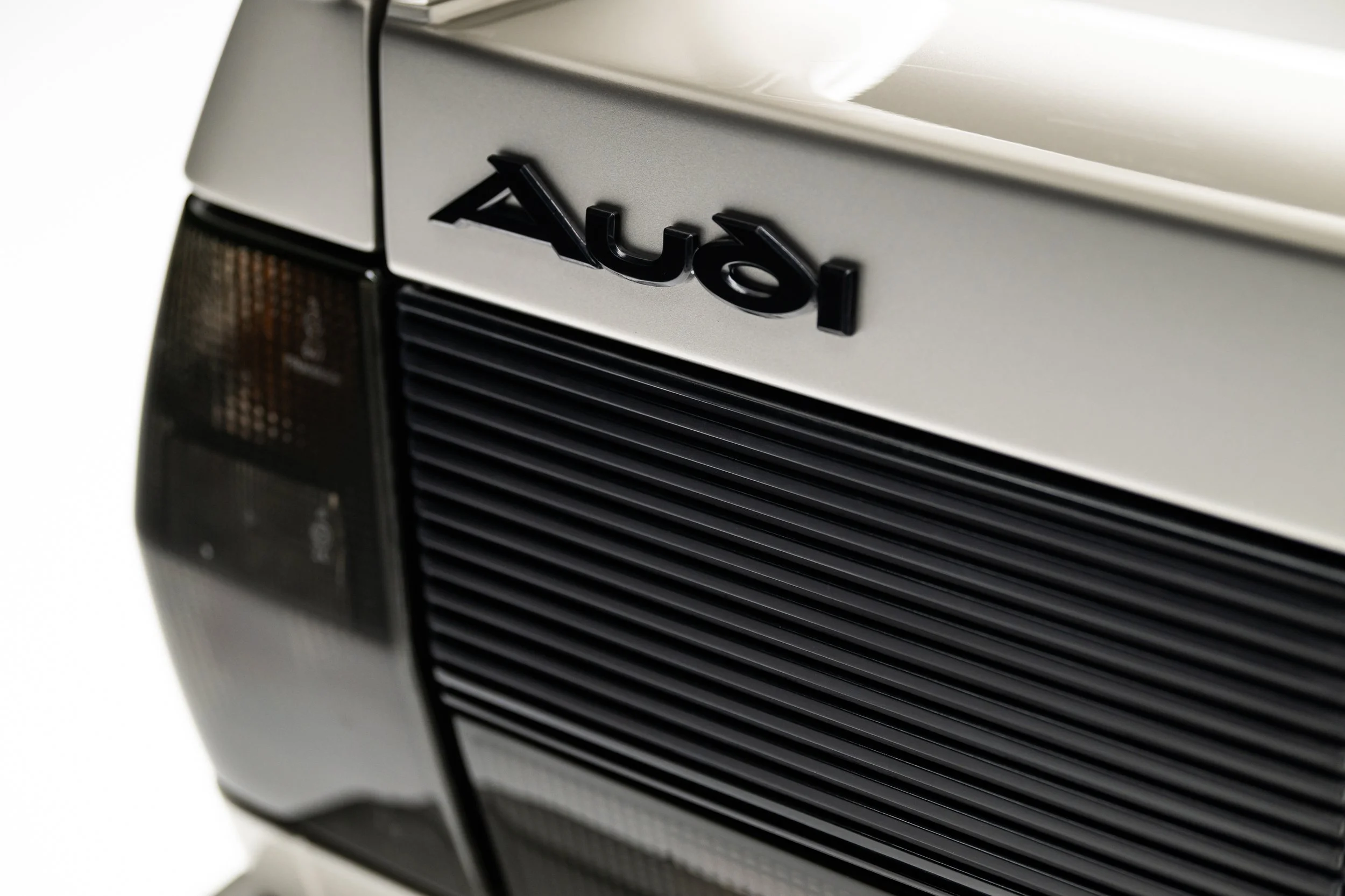 Close view of the rear Audi four-ring badge on the 1986 Ur-Quattro.