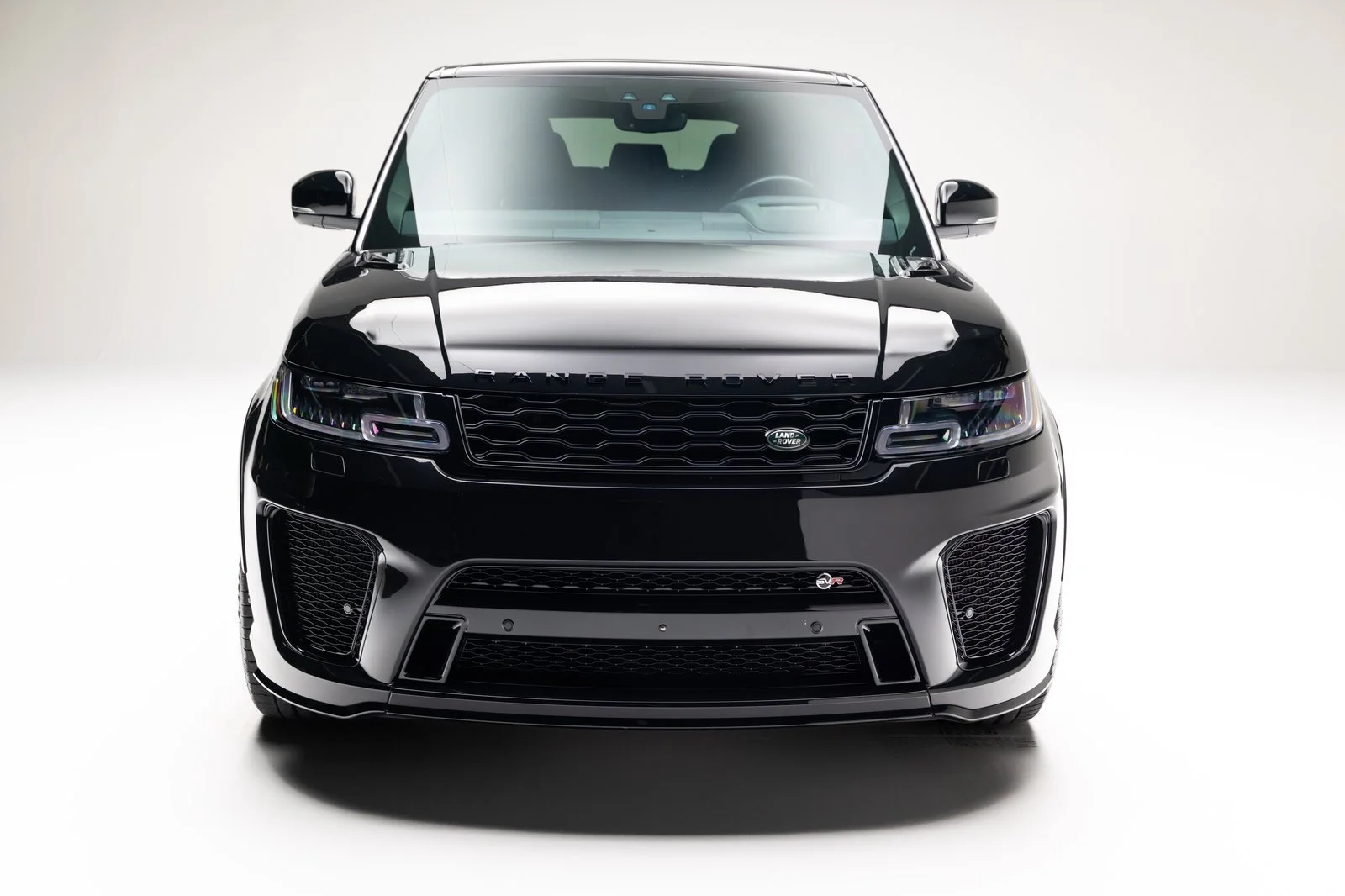 Head-on studio view of the black 2022 Range Rover Sport SVR.