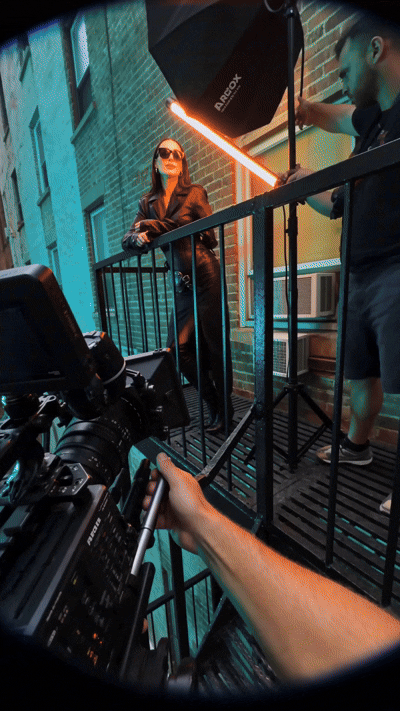 Behind the scenes clip of the lighting setup with the model on the staircase