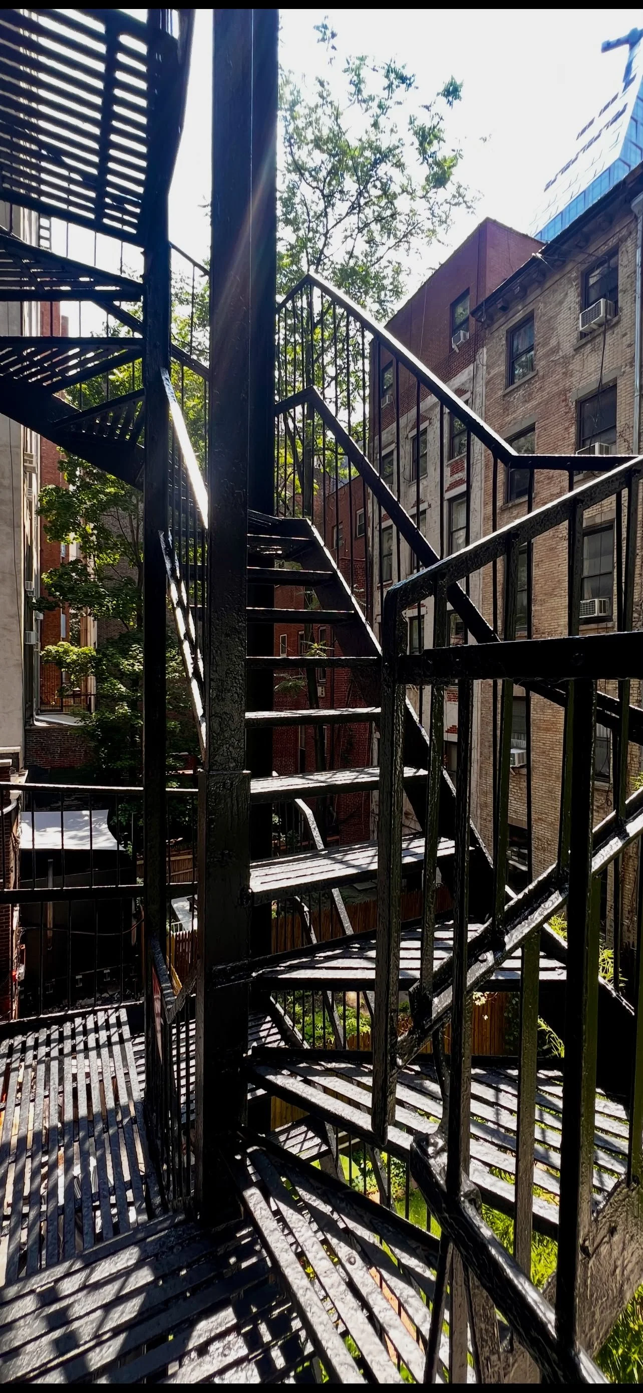 Spiral staircase view from loft window, iron fire escape exterior