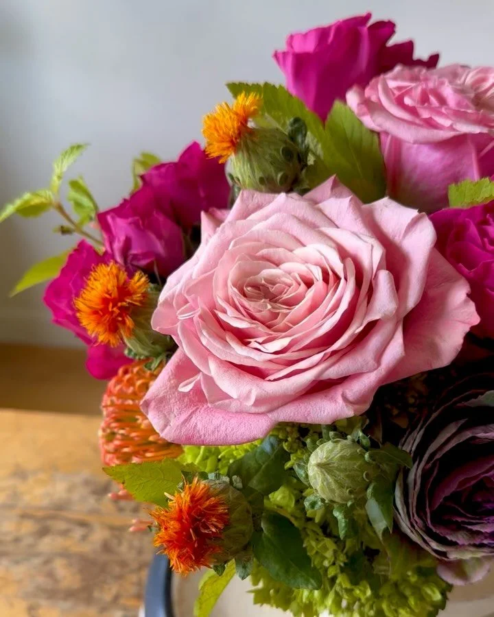 Oh the late summer / early fall colors and textures are so dreamy. 🌈 

This yummy design features kale, roses, pincushion flowers, ranunculus, and vibrant coxcomb. And, we are thrilled to report that safflower is back for the season!