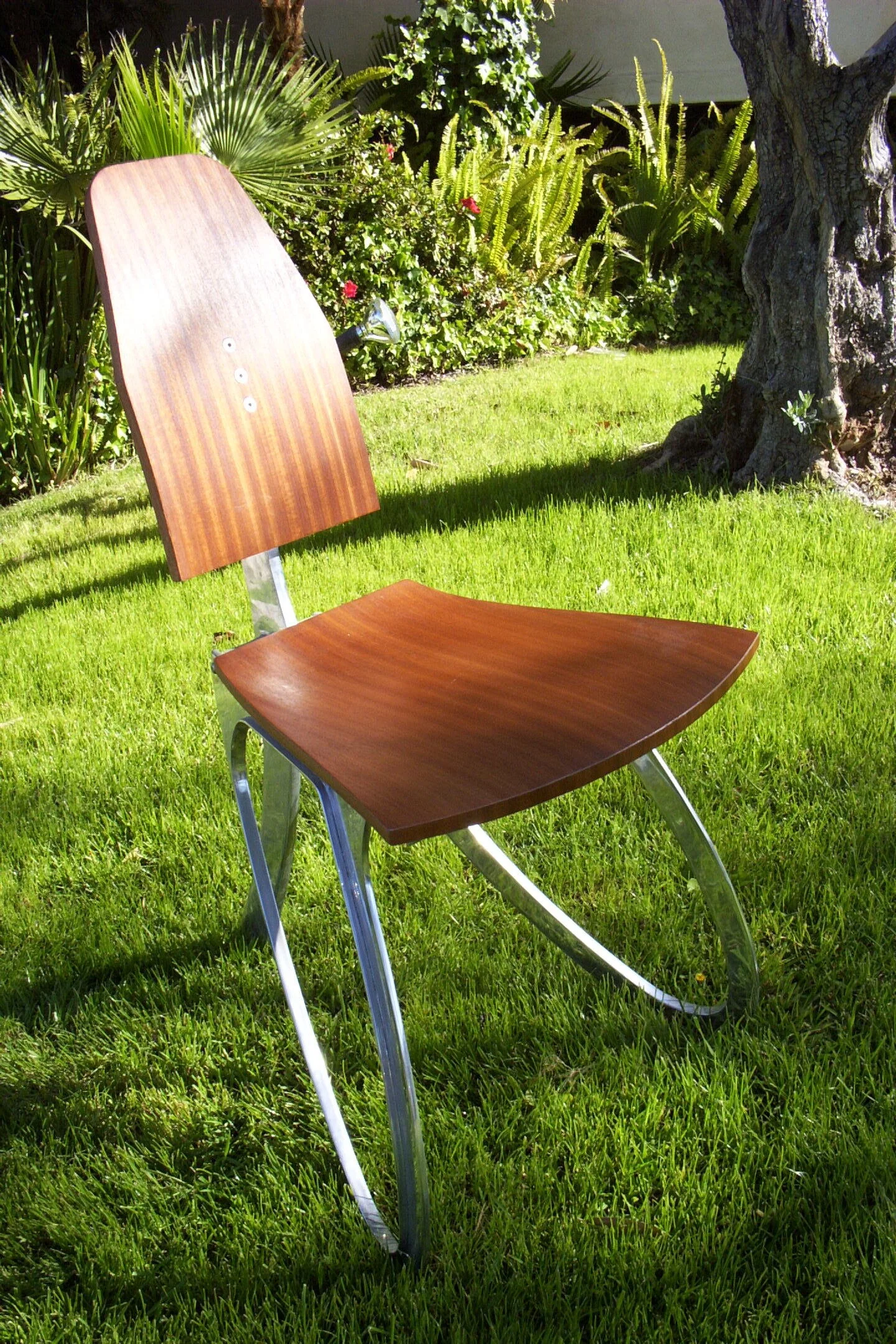 Chair:  Bent plywood and cast aluminum