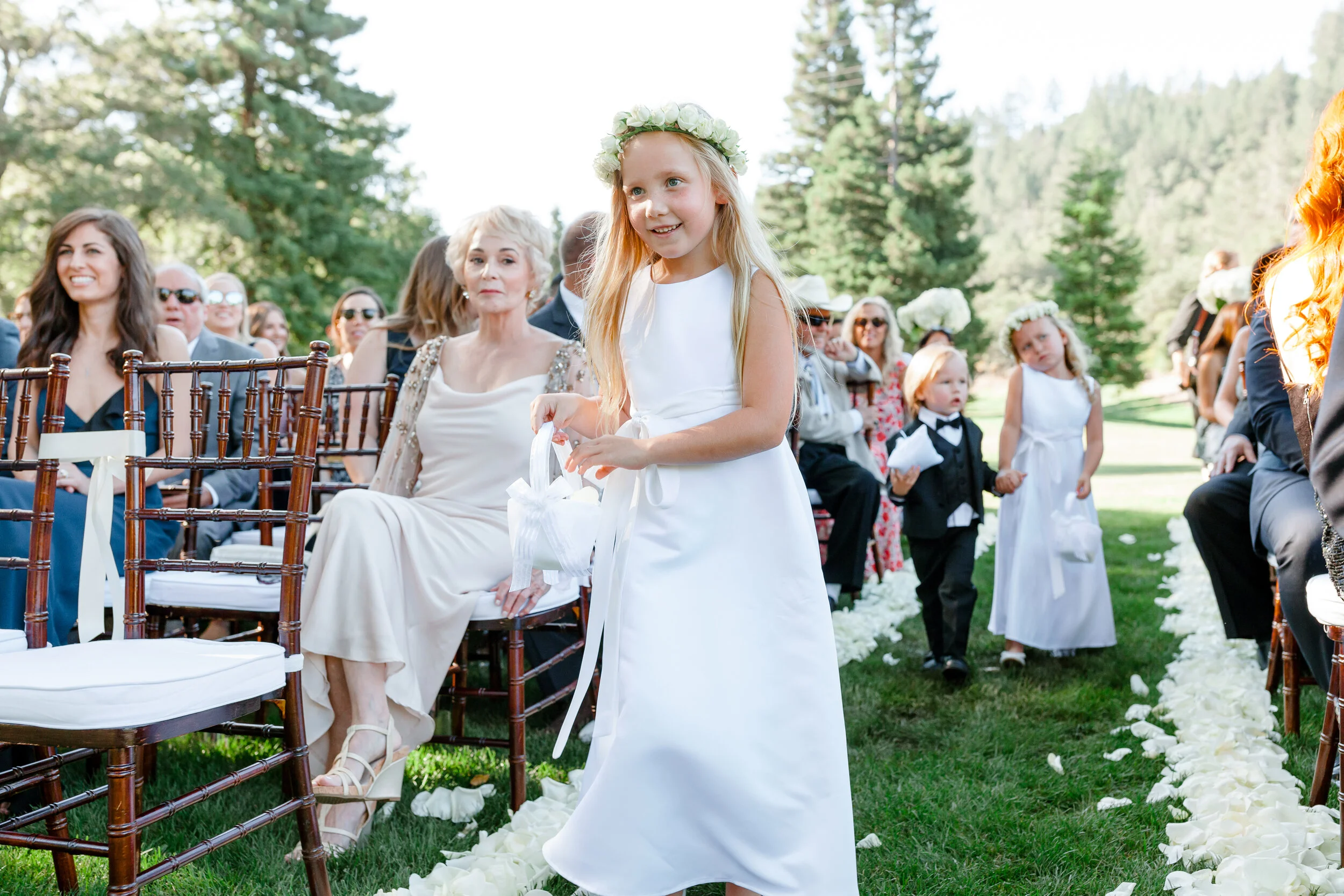 Flower girl walks down the aisle at classic modern San Francisco wedding image name: wedding-florist-boise-636