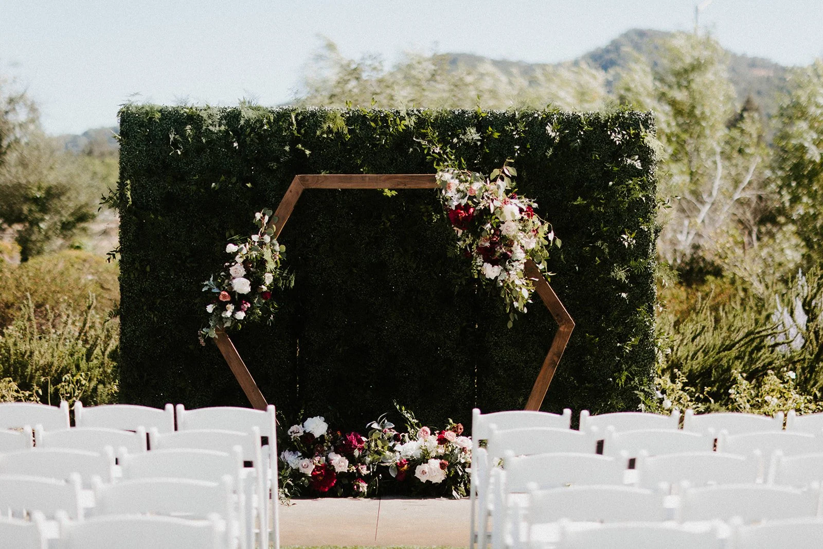 Hexagon shape wooden alter with burgundy roses white roses image name: wedding-florist-boise-196
