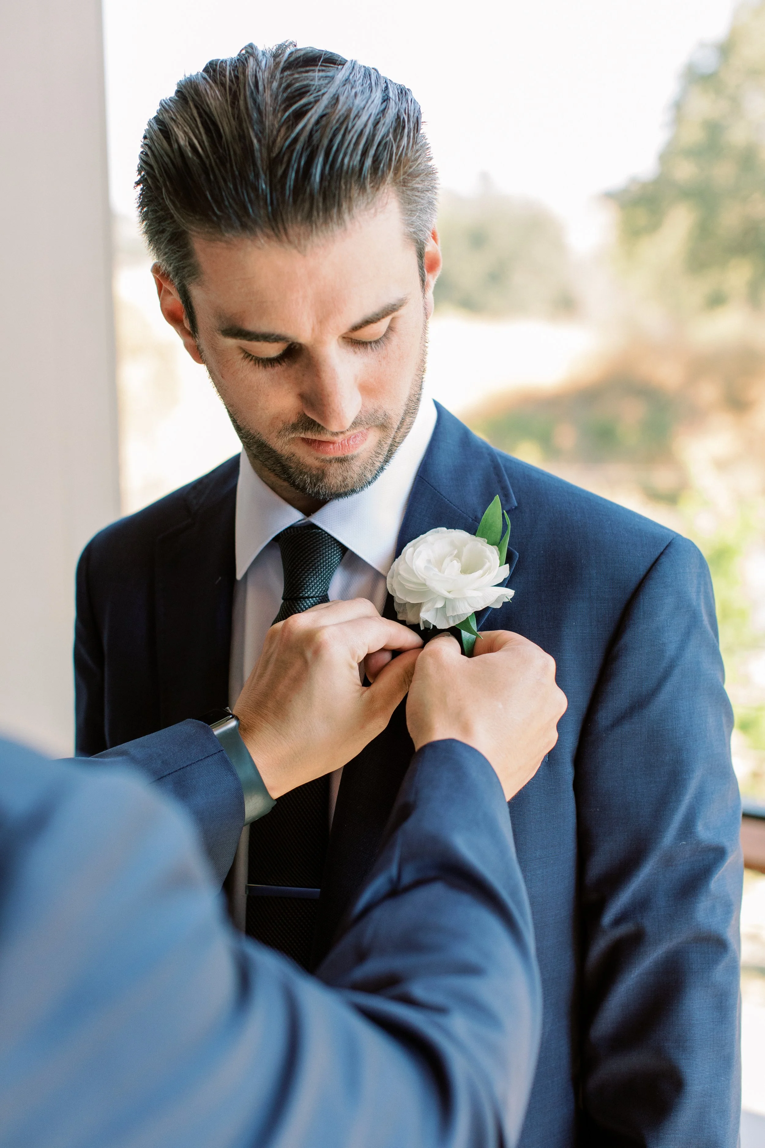 Groom with white rose boutonnière image name: wedding-florist-bosie-427