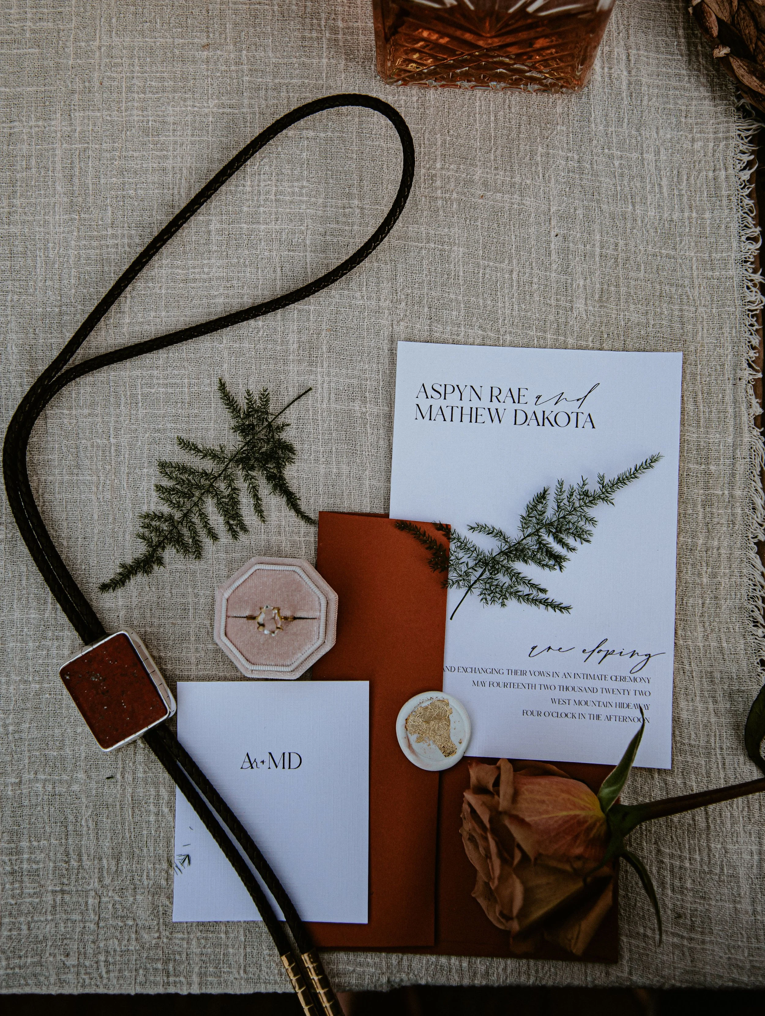 Wedding invitations ferns boa necktie, engagement ring rose Bay Area CA. Image name: wedding-florist-boise-116