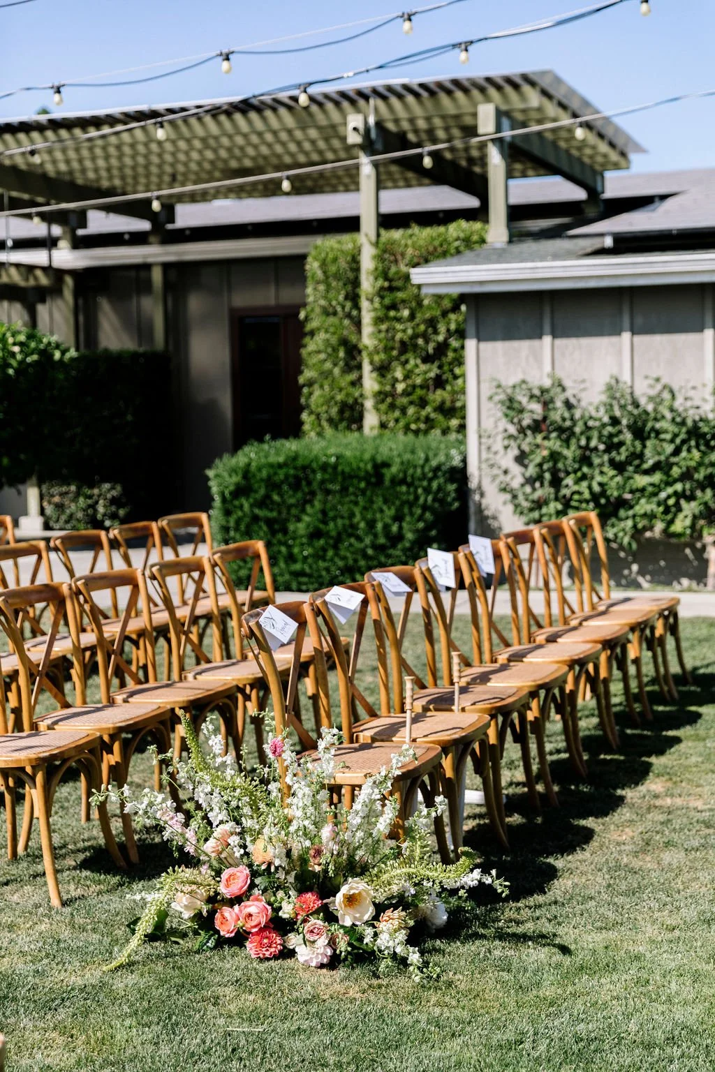 Outdoor wedding floral arrangement of roses, ranunculus, peonies. Image name: wedding-florist-boise-83