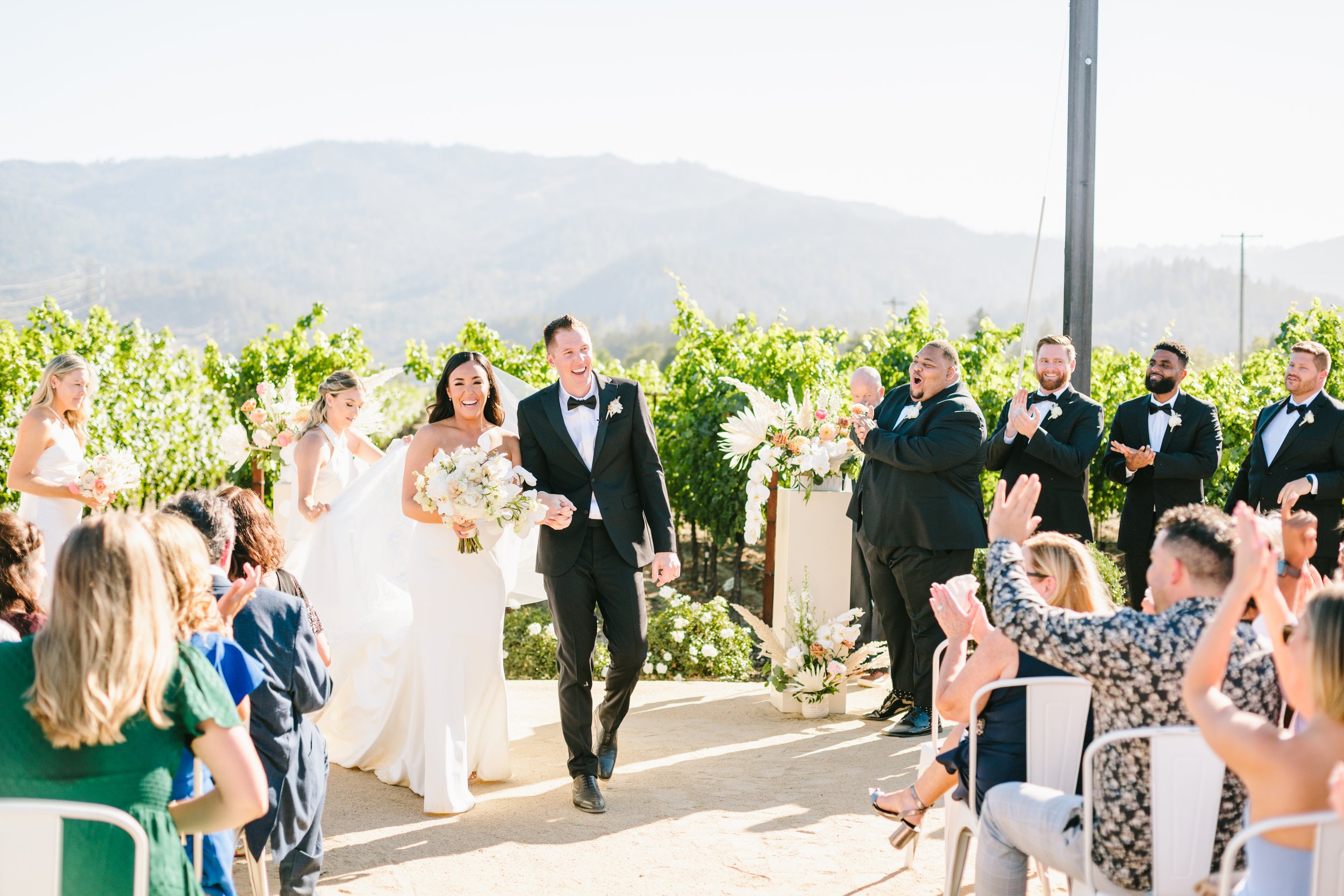 Couple walks down the aisle at California vineyard wedding. Image name: wedding-florist-boise-160