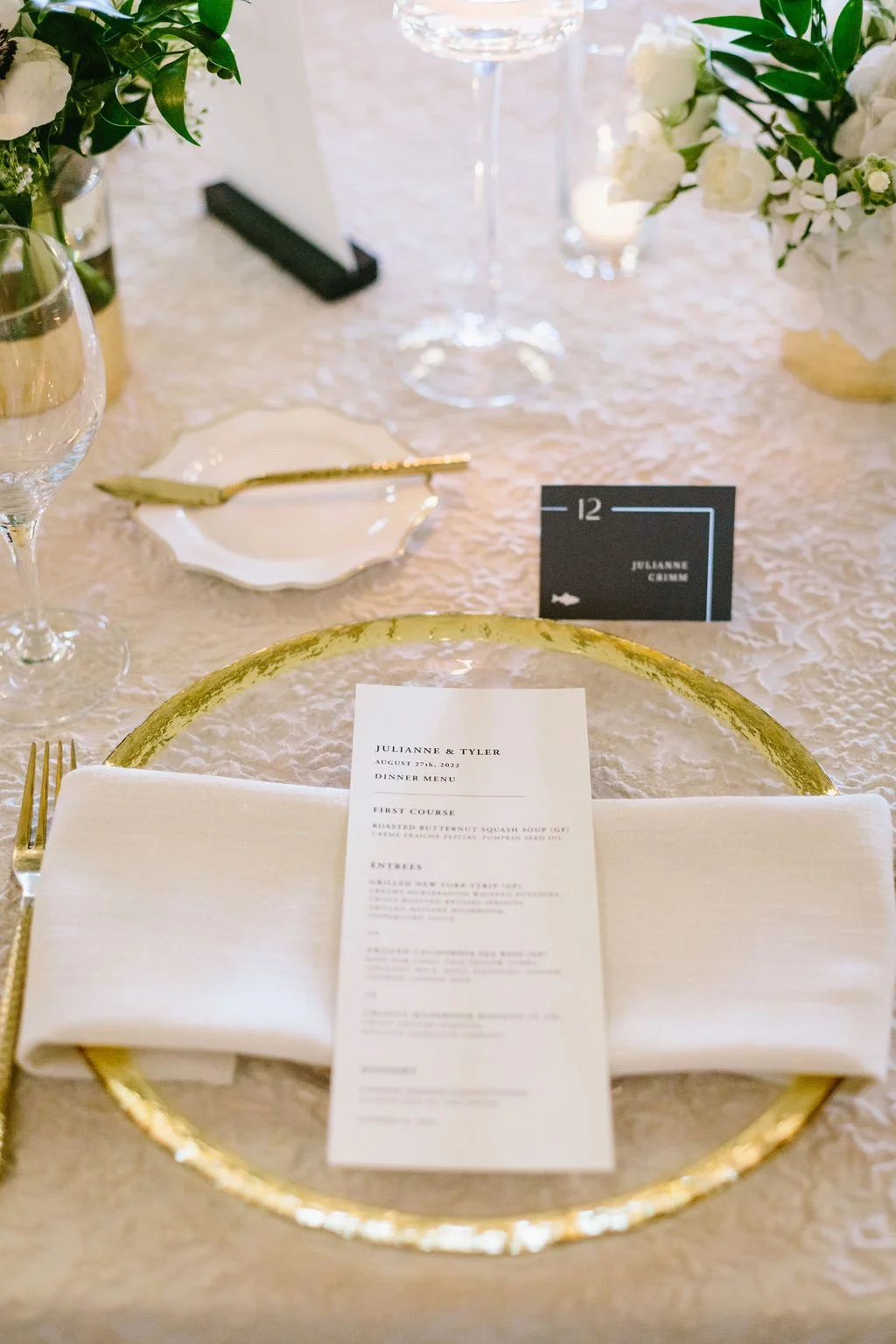 Menu on a clear plate that has gold edging San Francisco wedding. Image name: wedding-florist-boise-66