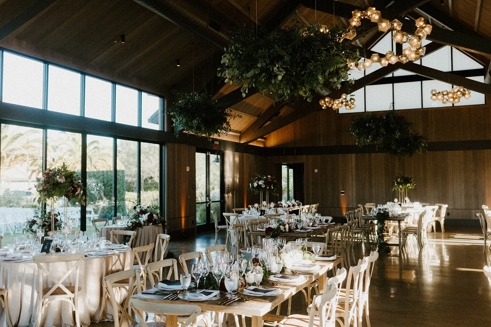 Indoor wedding reception fern hanging from ceiling white rose centerpieces image name: wedding-florist-boise-216