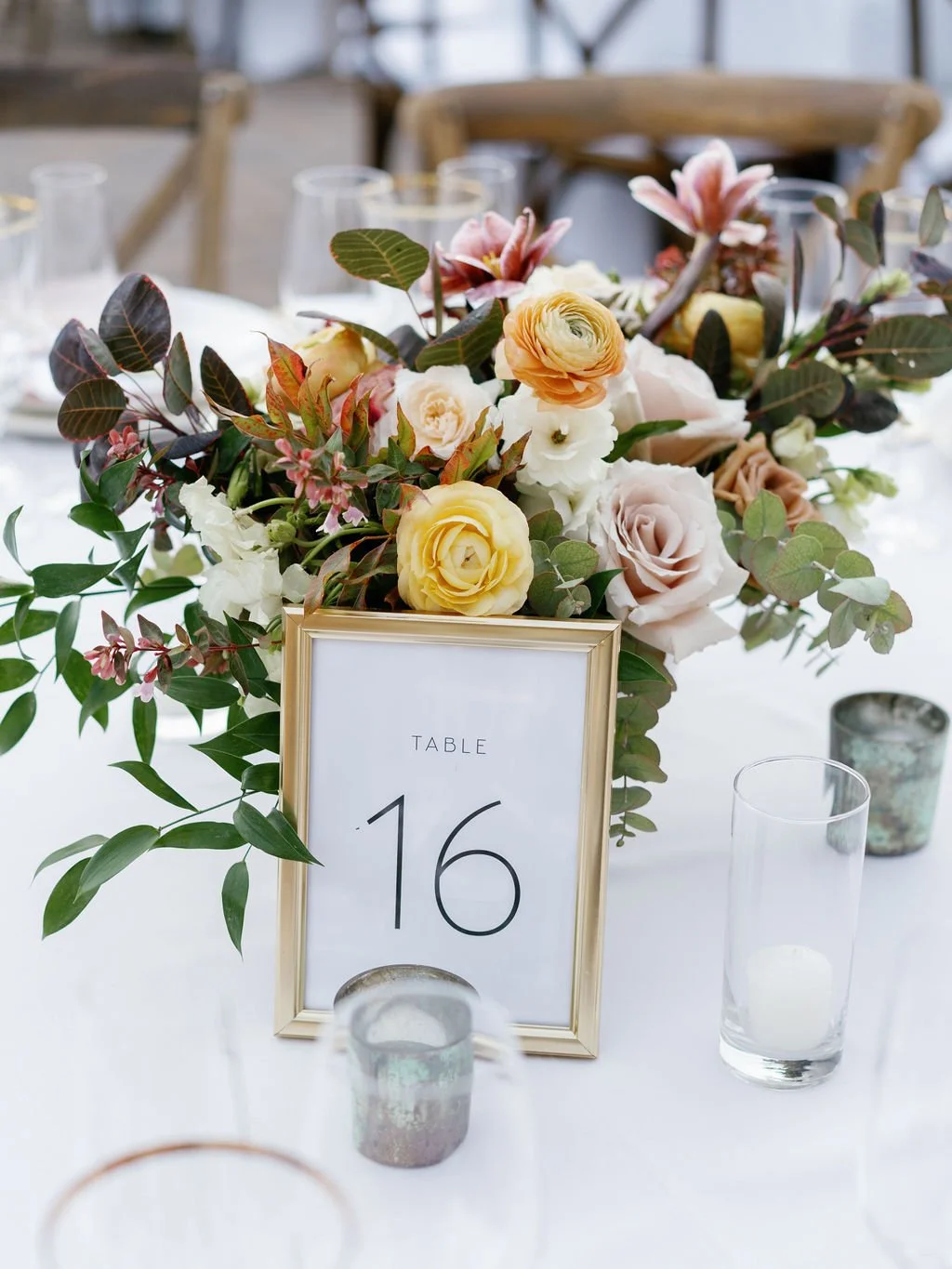 Bouquet yellow ranunculus blush roses autumn color flowers behind table setting image name: wedding-florist-boise-182