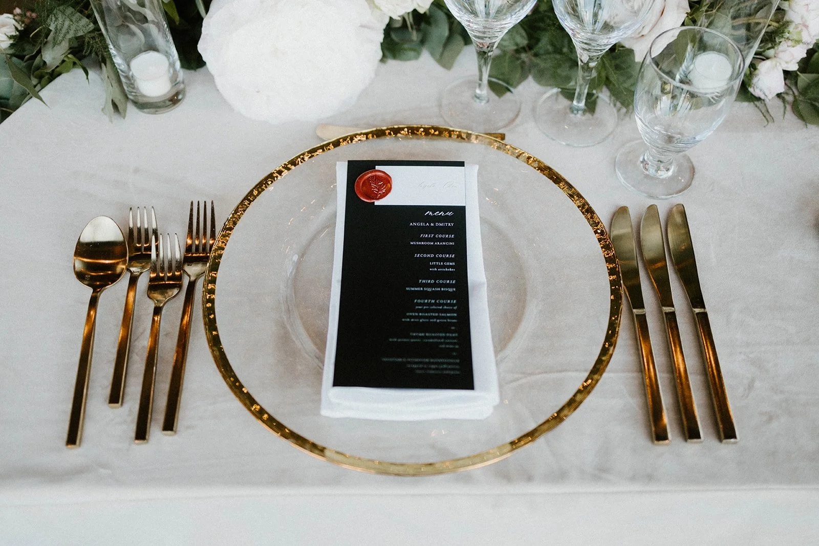 Black and white menu gold rim plates gold silverware image name: wedding-florist-boise-214
