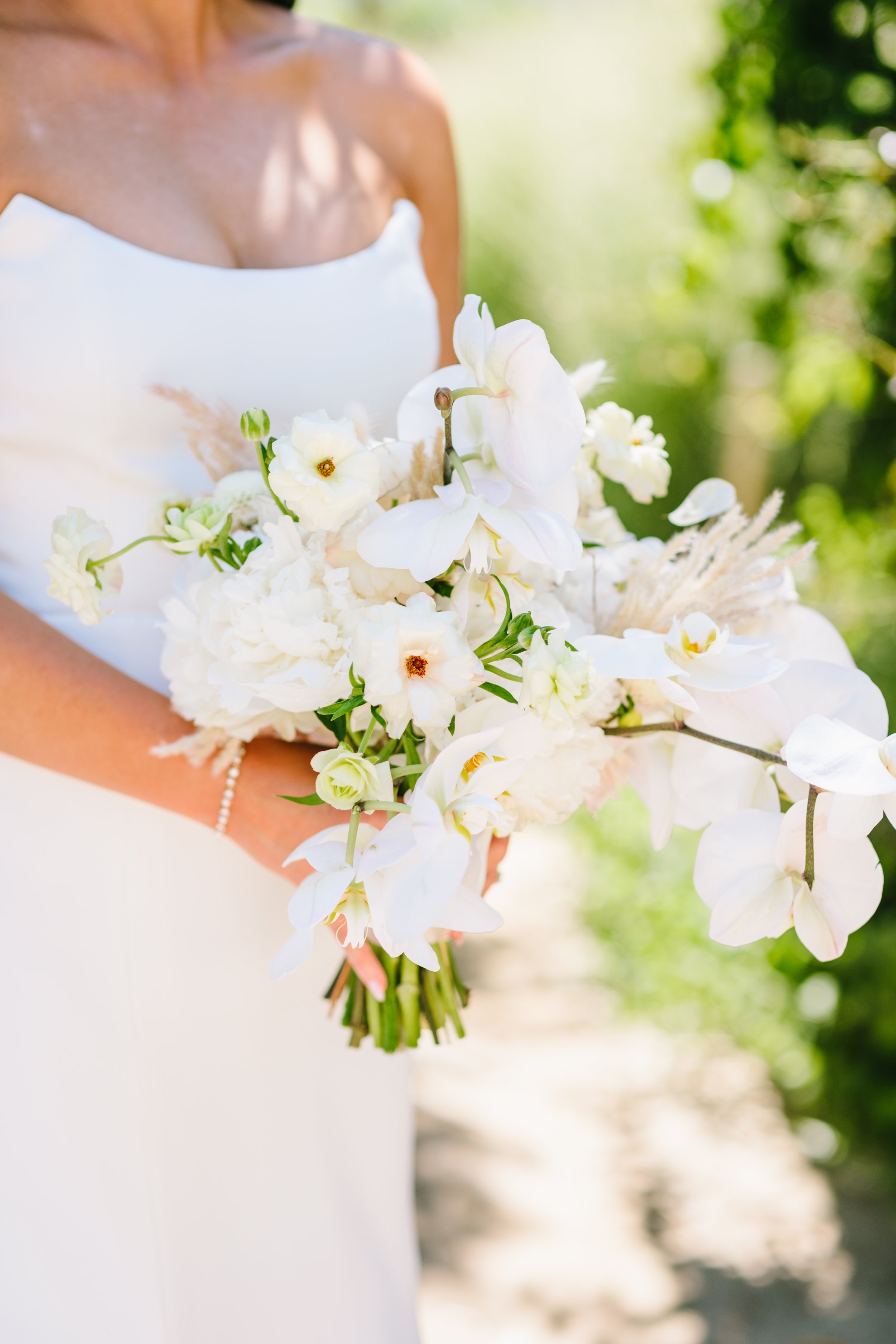 Bridal bouquet of wild white roses, white orchids, white hydrangeas Napa Valley. Image name: wedding-florist-boise-150