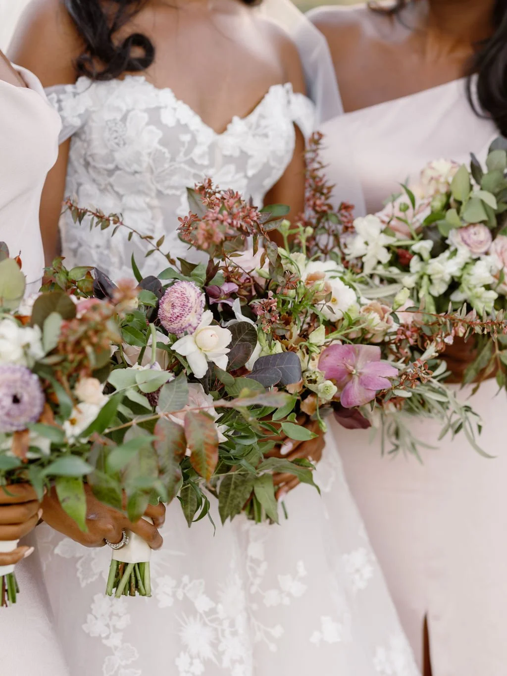 Wedding party holding bouqets white rose blush roses cosmos image name: wedding-florist-boise-186