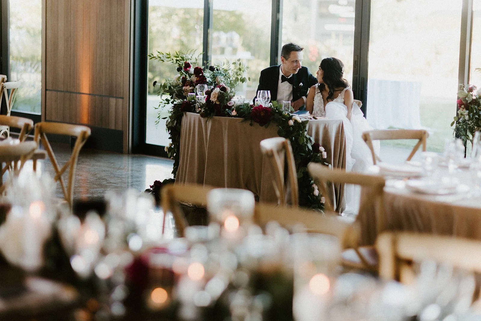 Couple sitting main table white roses image name: wedding-florist-boise-207
