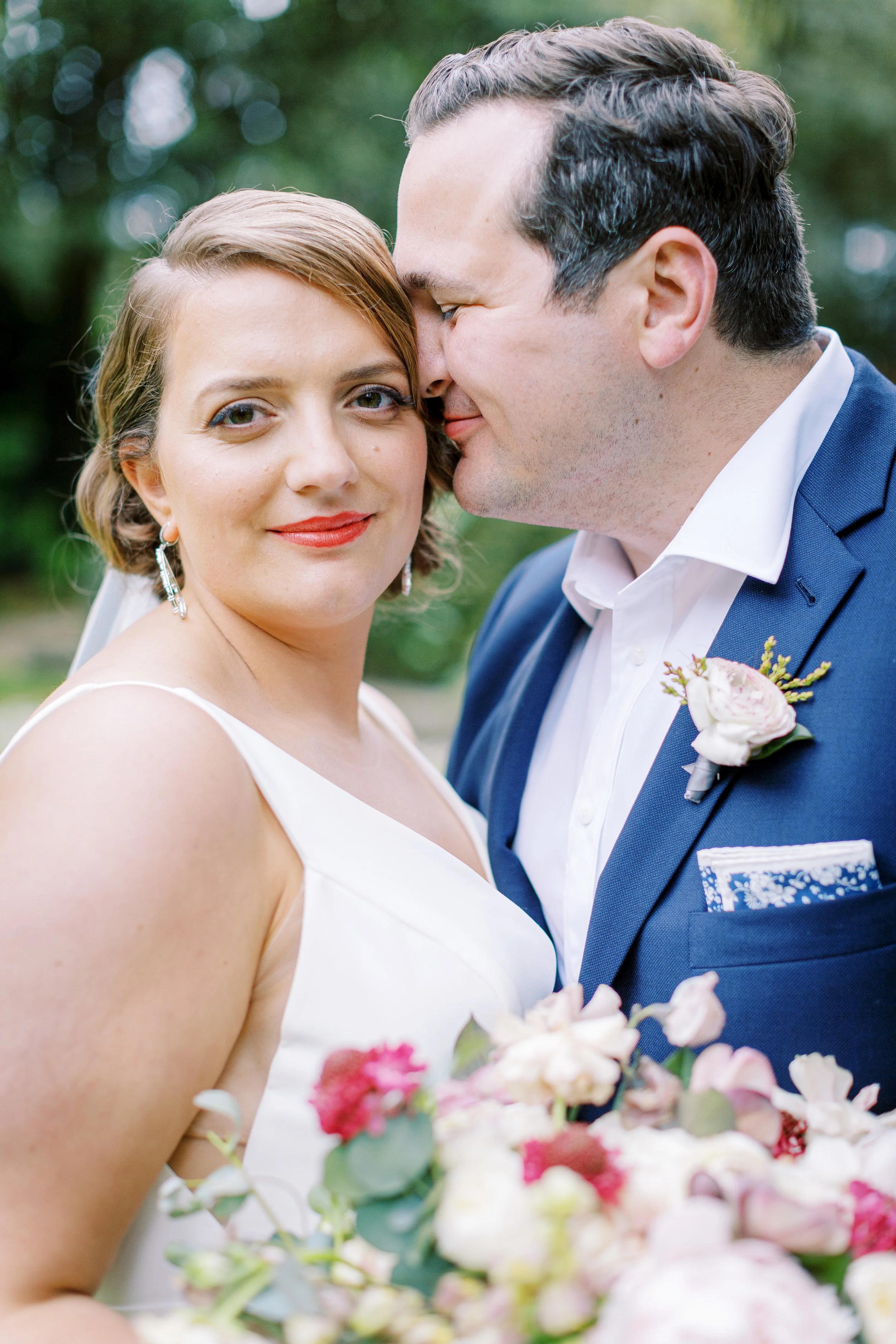 Bride and groom with red roses white roses peonies anemone image name: wedding-florist-boise-414