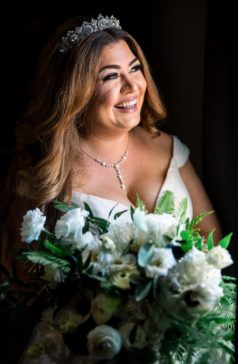 Bride holds bouquet of white roses white anemone wearing diamond tiara image name: wedding-florist-boise-385