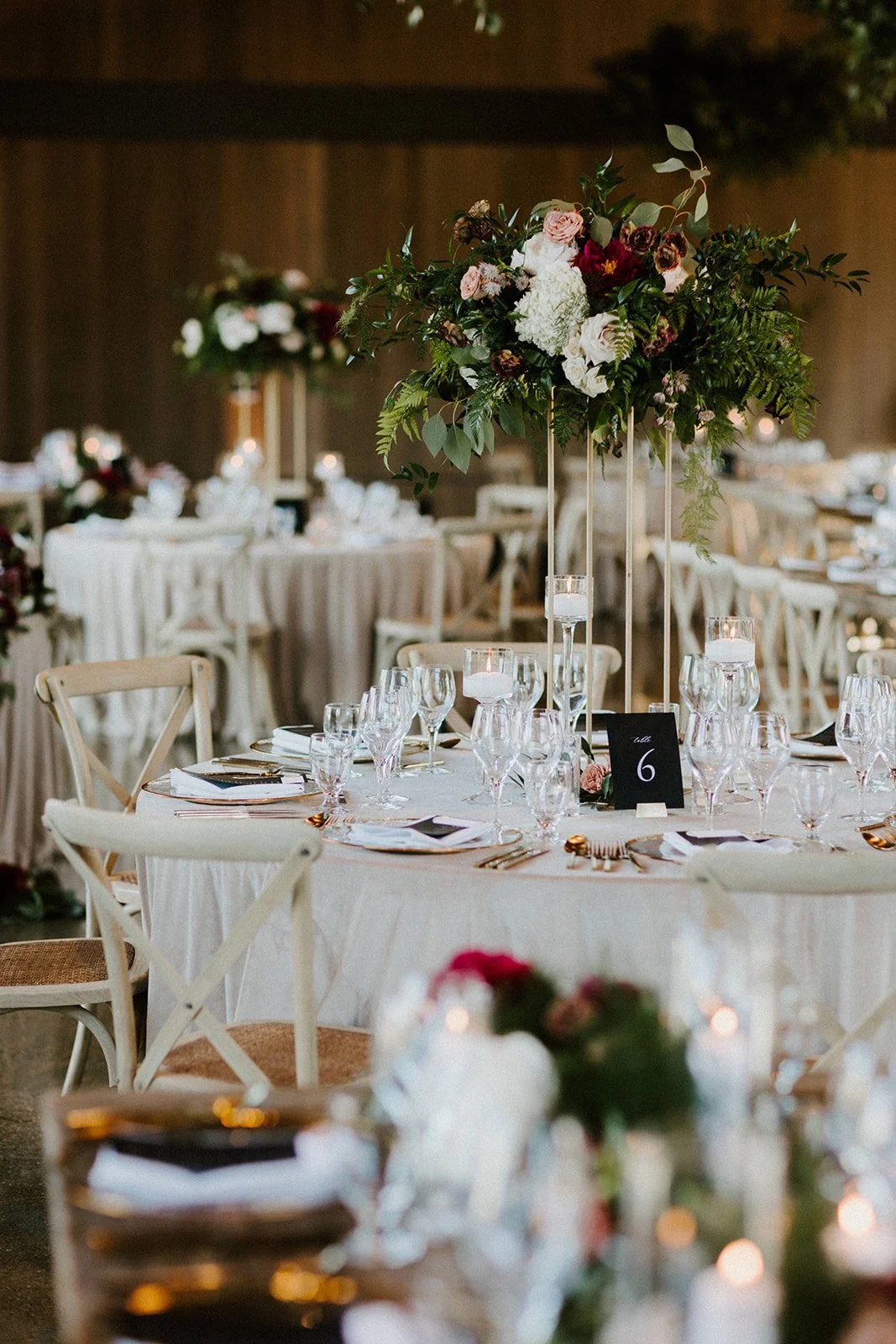Indoor reception tall table centerpieces white roses image name: wedding-florist-boise-208