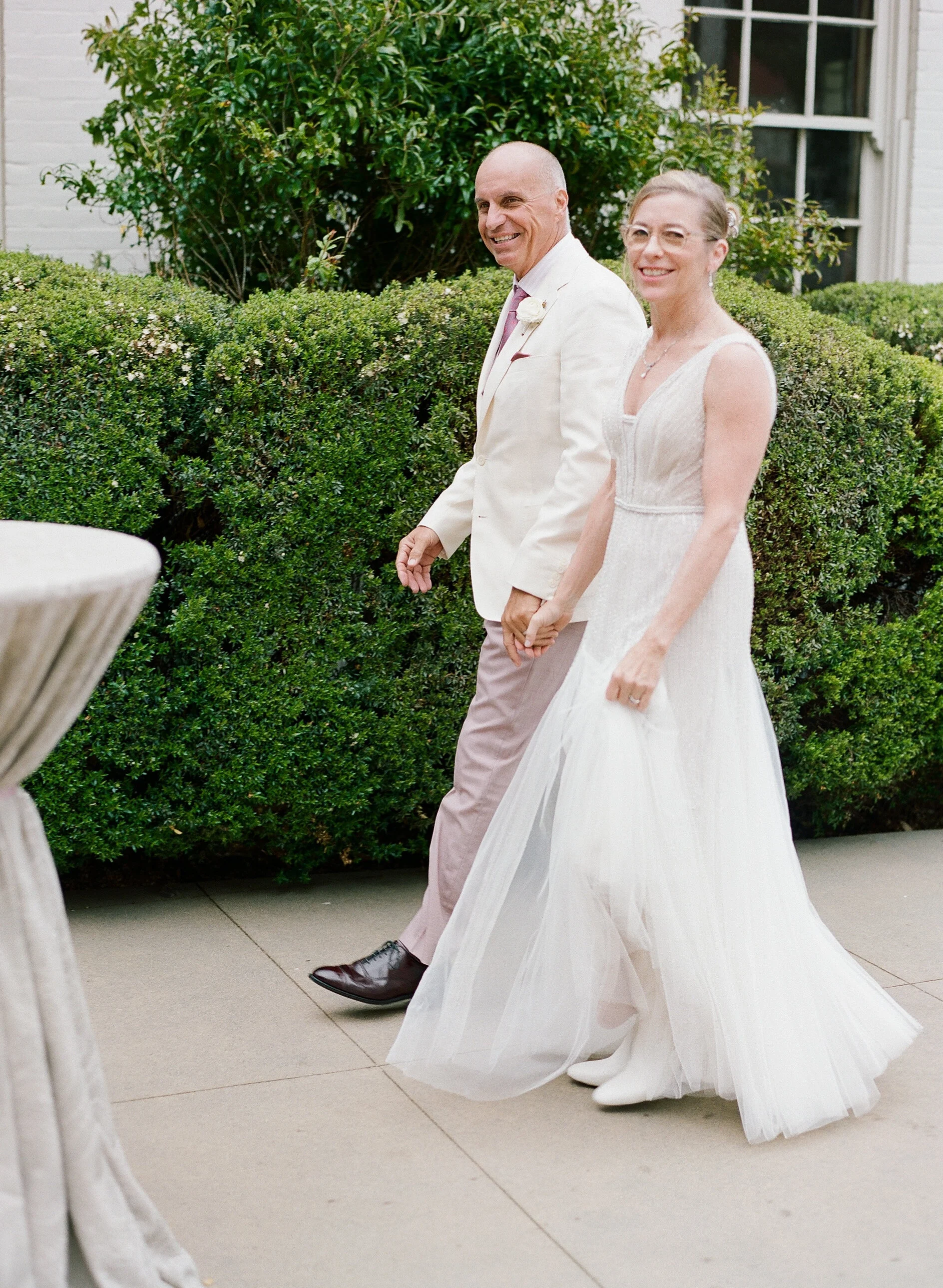 Couple walk together at Cavallo Point San Francisco, CA wedding image name: wedding-florist-boise-599