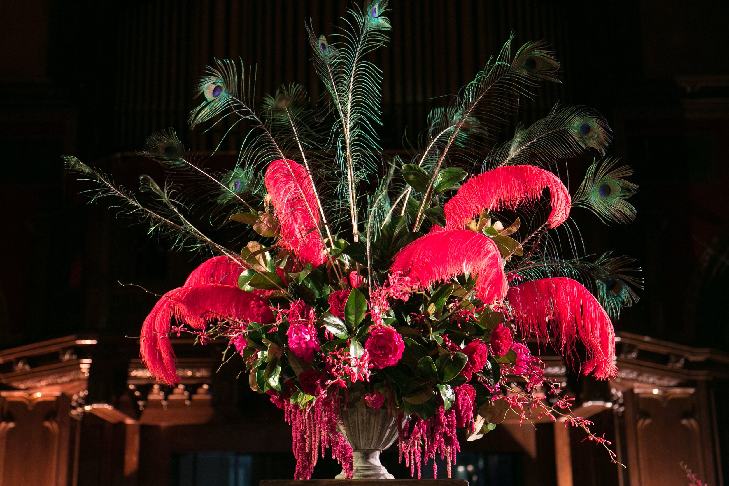 Floral arrangement red peonies red feathers black feathers masquerade ball San Francisco image name: corporate-florist-boise-35
