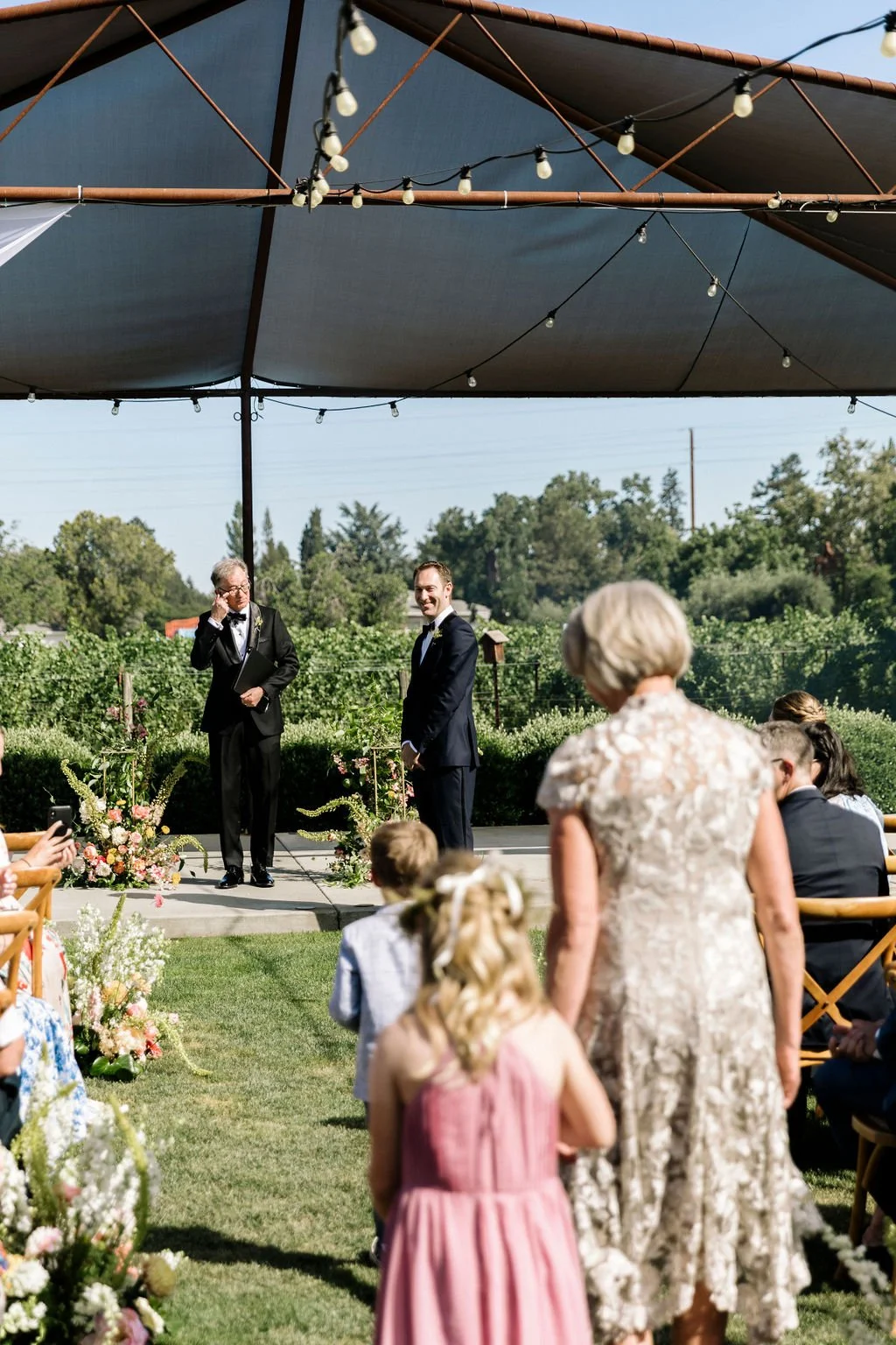 Wedding participants walking down the aisle at San Francisco farm wedding. Image name: wedding-florist-boise-85