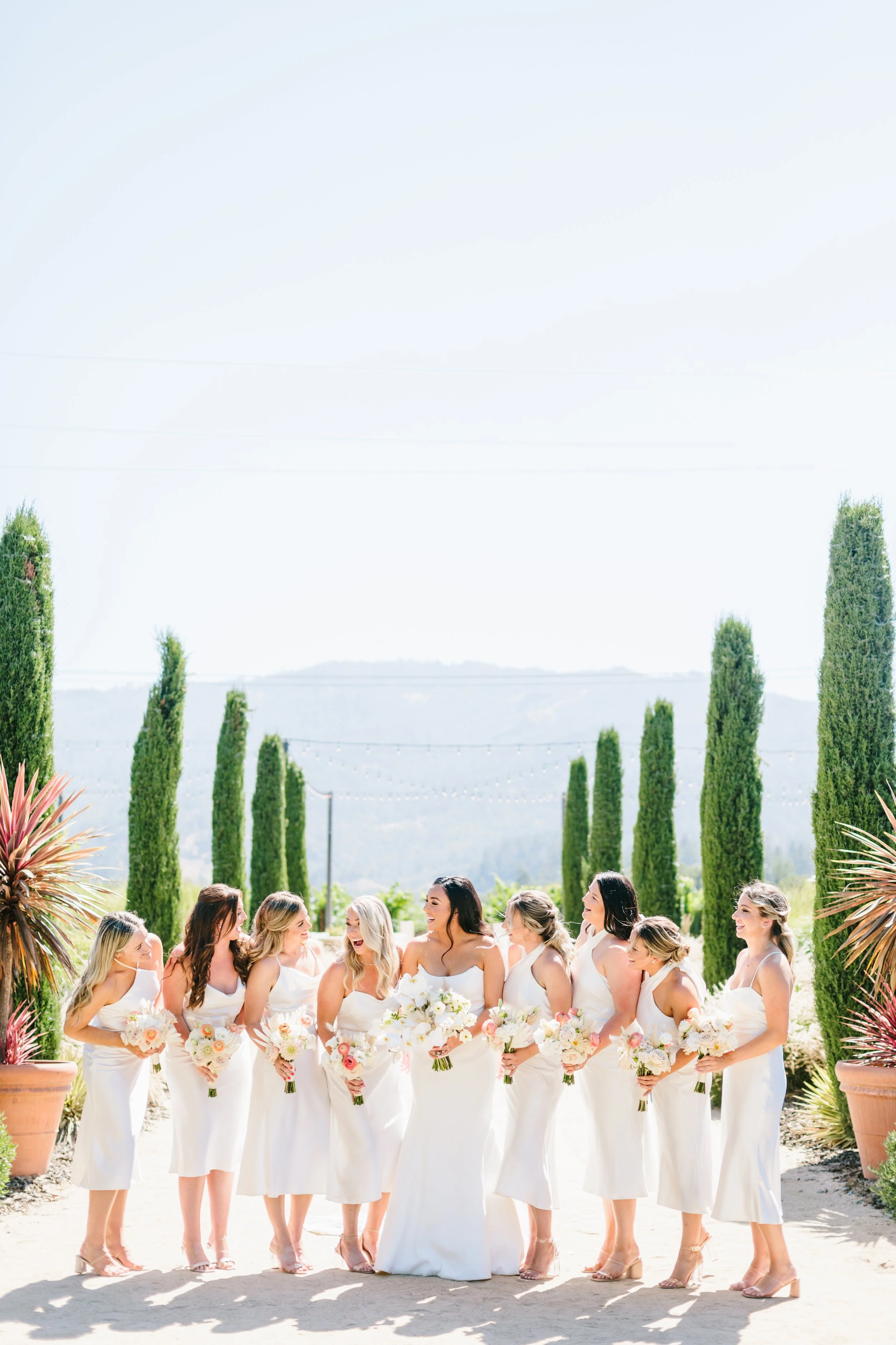Bridal party bouquets wild white roses, white orchids, white hydrangeas Napa Valley Image name: wedding-florist-boise-152