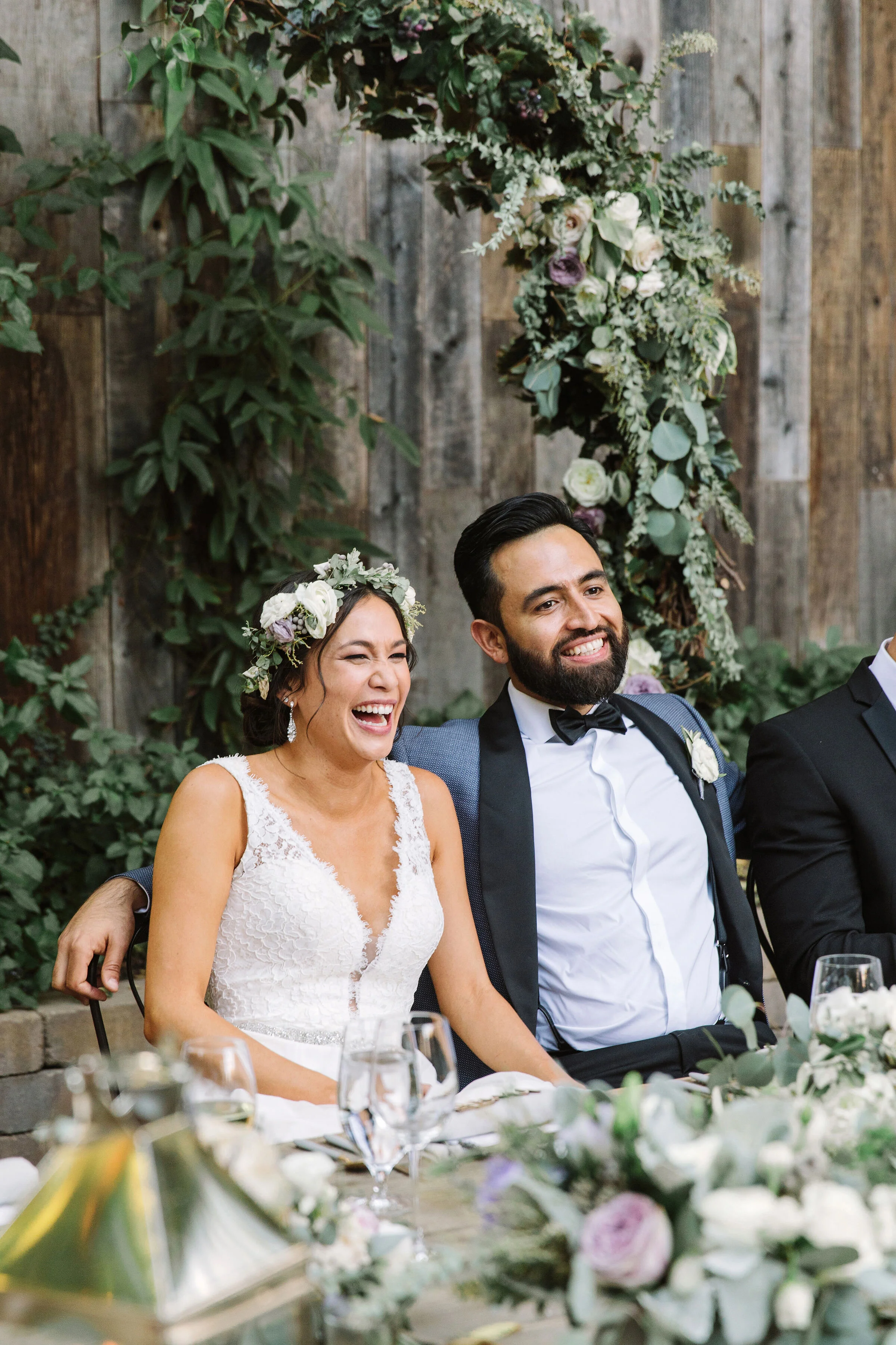 Couple sit with lavender roses and white roses for Sonoma county wedding image name: wedding-florist-boise-755