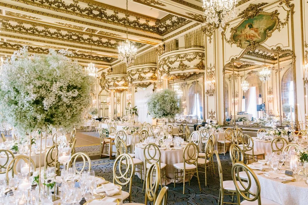 Elegant centerpieces reception tall vases large round baby's breath gold San Francisco California. Image name: wedding-florist-boise-56