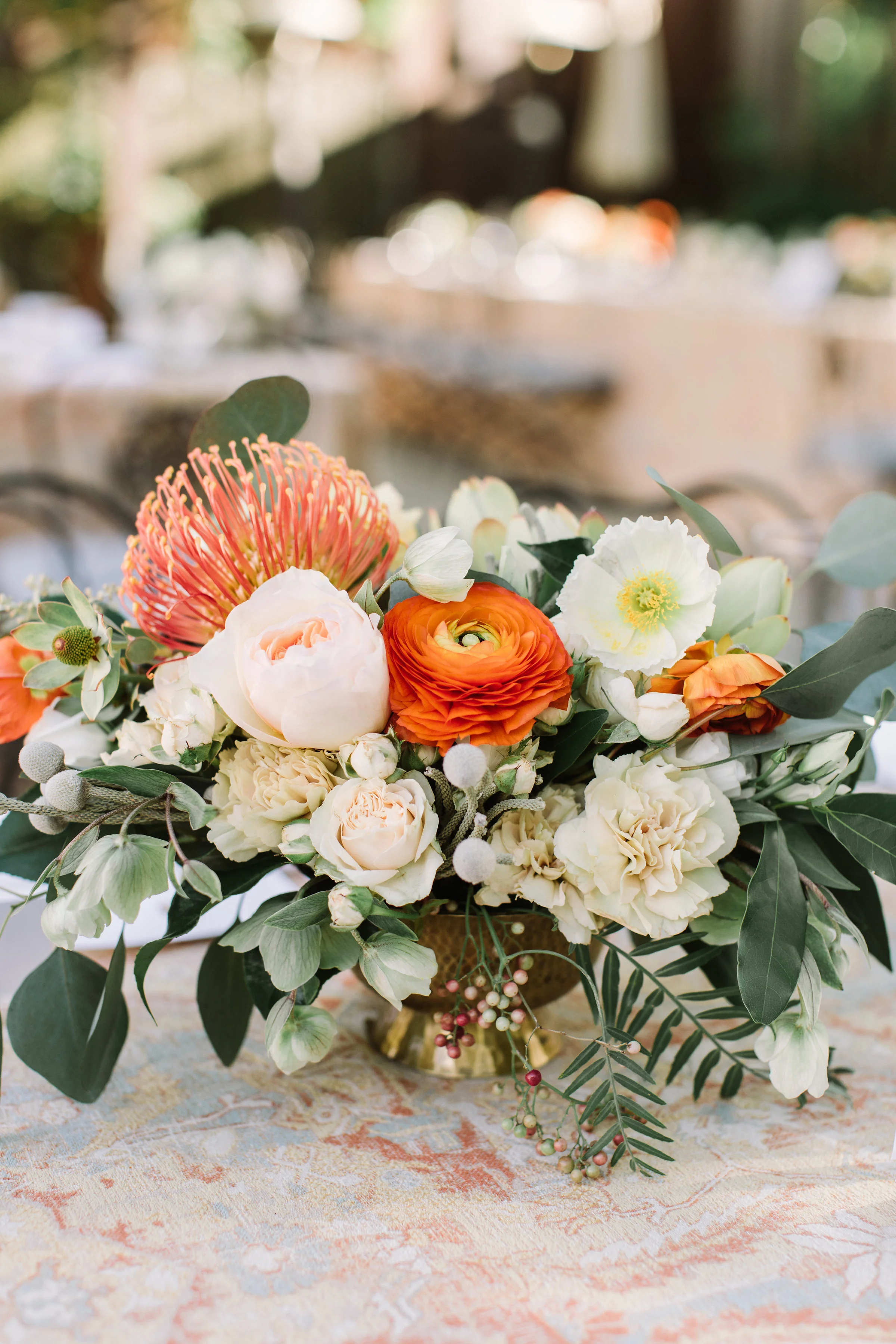 Floral arrangment of protea, orange poppy blush roses wild roses Sonoma County image name: wedding-florist-boise-767