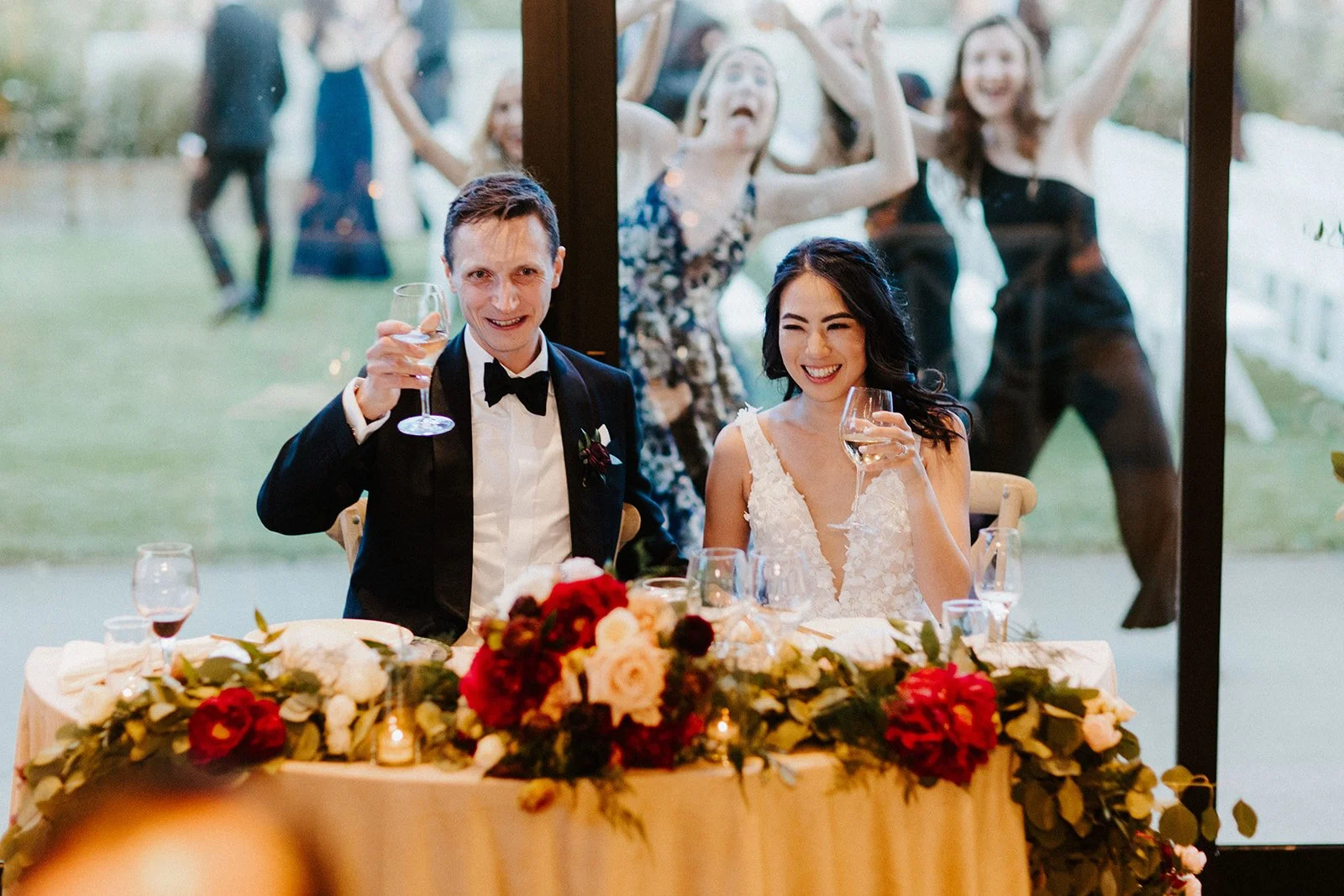 Wedding couple photo bomb white roses blush roses white peonies burgundy roses image name: wedding-florist-boise-224