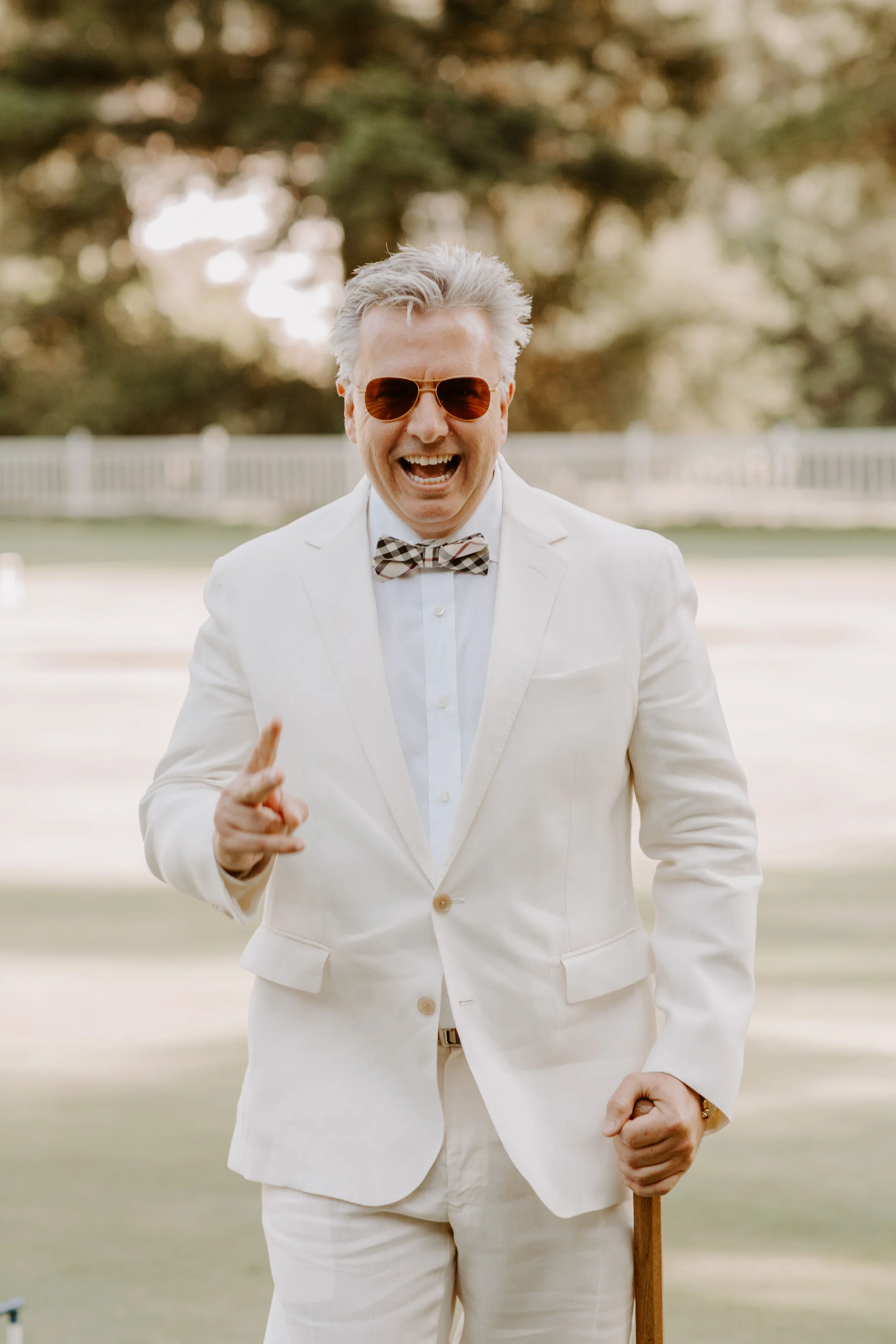 Groom smiles at outdoor wedding Promontory Estates Oakville, CA image name: wedding-florist-boise-571