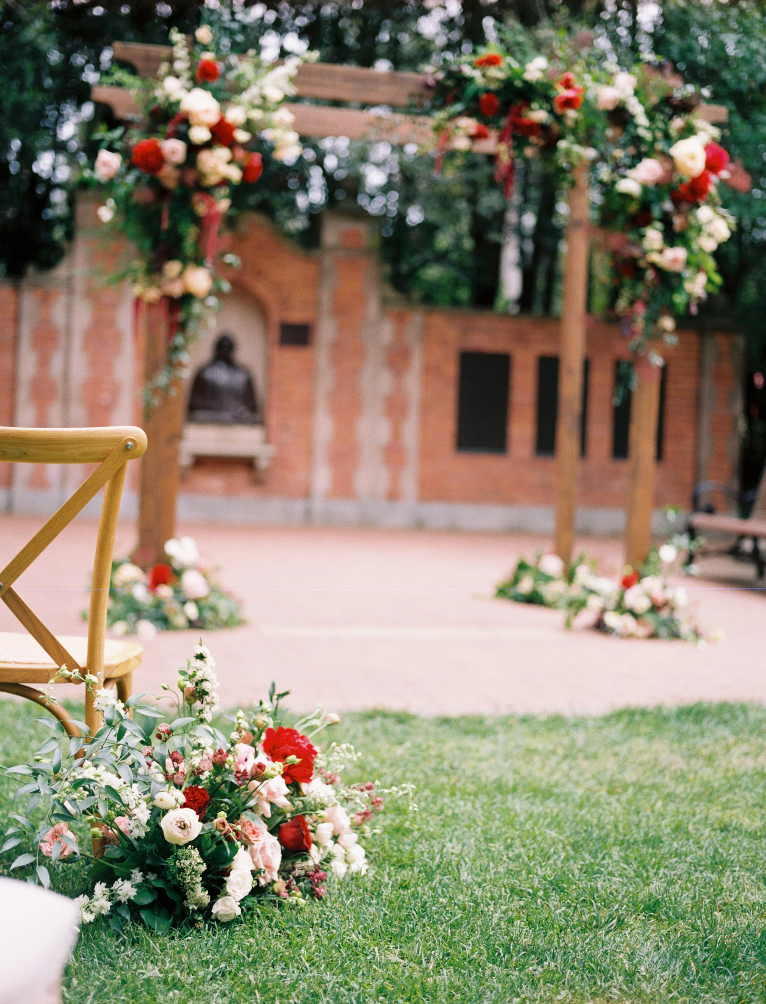 Florals arranged for an outdoor Boise, ID wedding red peonies red roses image name: wedding-florist-boise-403
