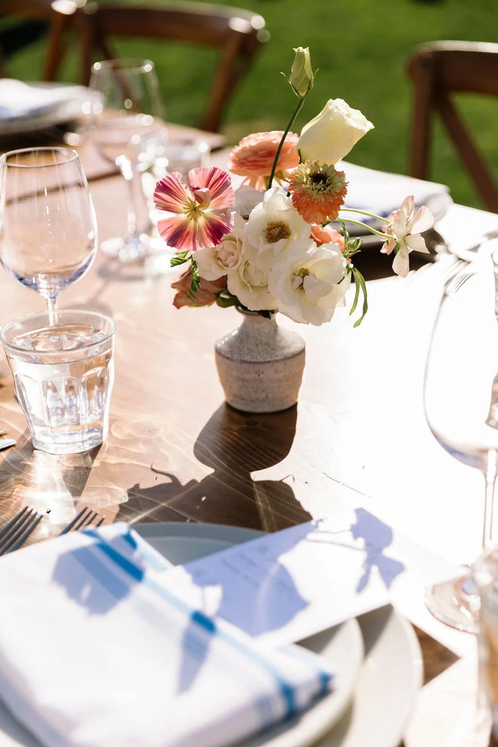 Vase filled  pink peonies, anemones, various other white flowers. Image name: wedding-florist-boise-94