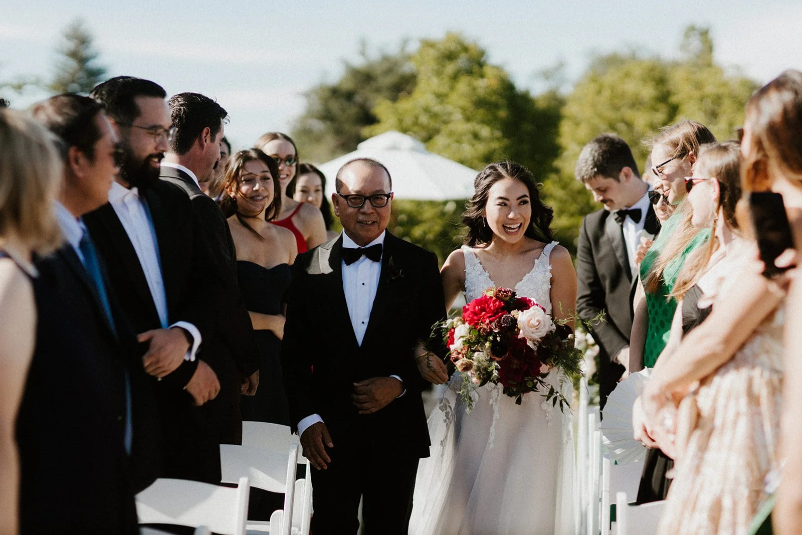 Father walking bride burgundy roses Burgandy peonies white roses image name: wedding-florist-boise-215