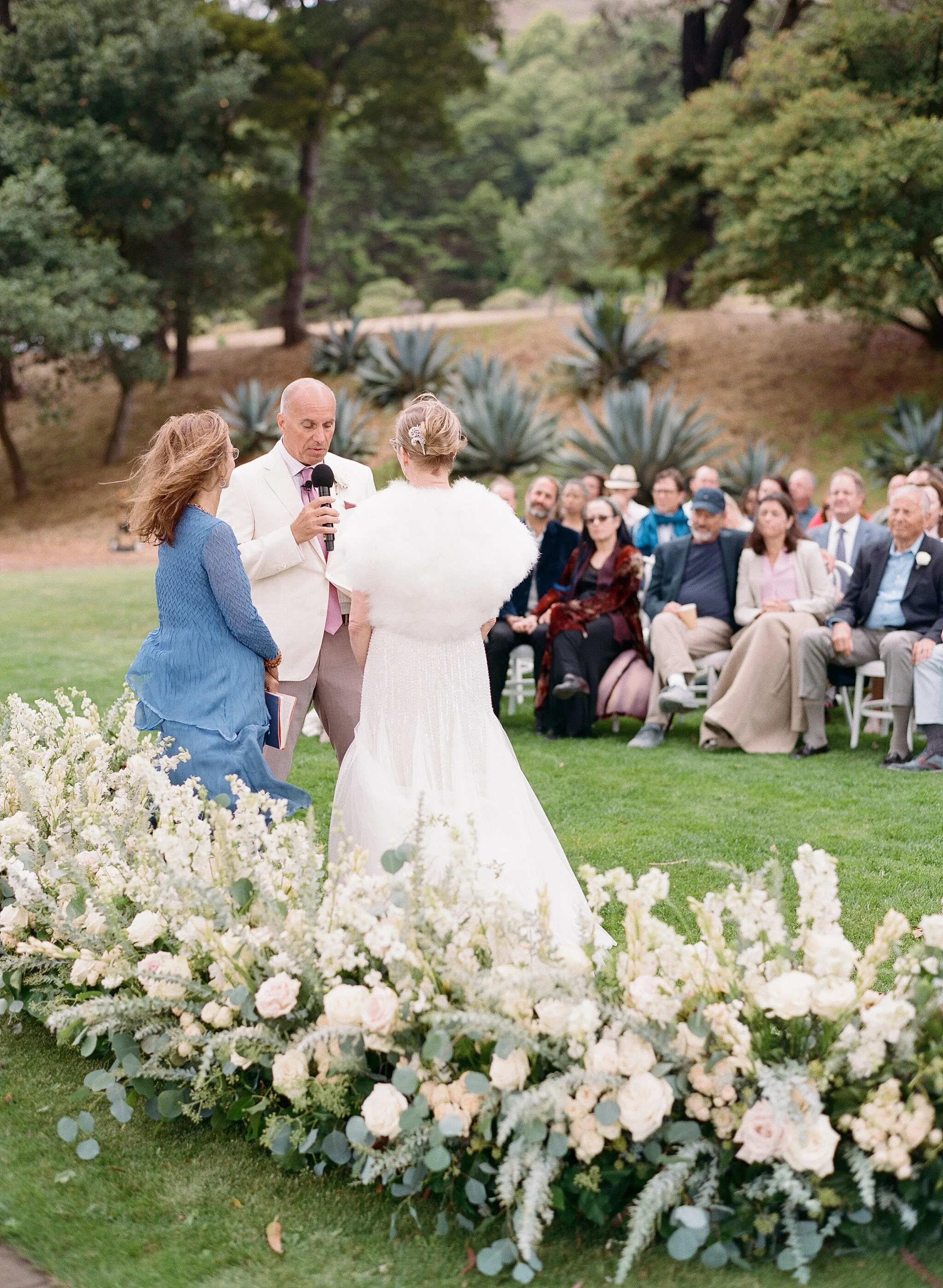 Couple exchange vows at outdoor Cavallo Point wedding image name: wedding-florist-boise-587