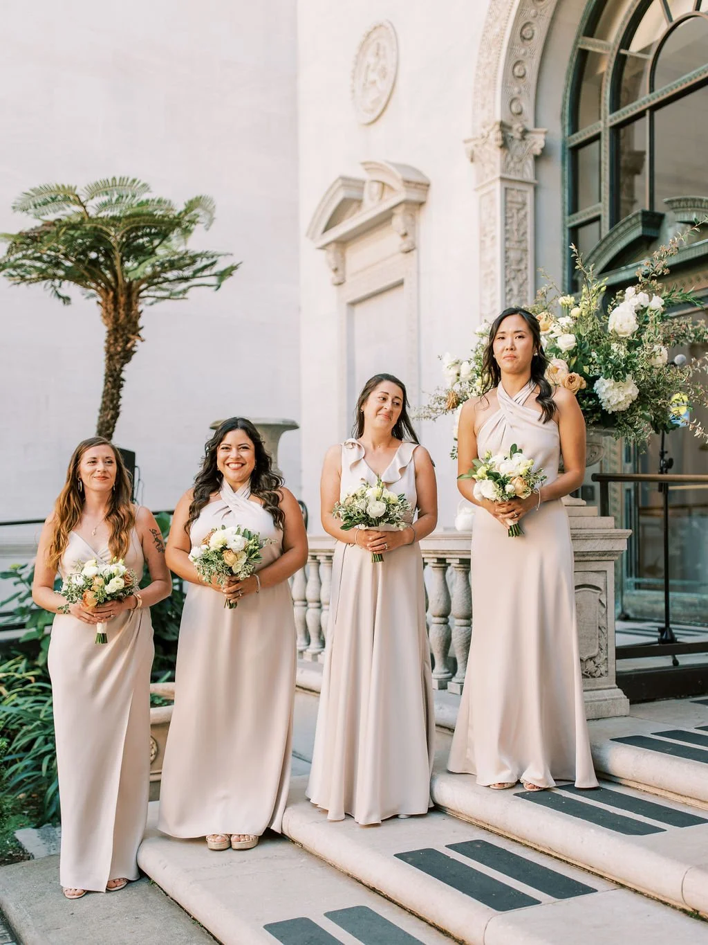 Bridesmaids hold bouquets of white roses, yellow roses, rustic color roses. Image name: wedding-florist-boise-137