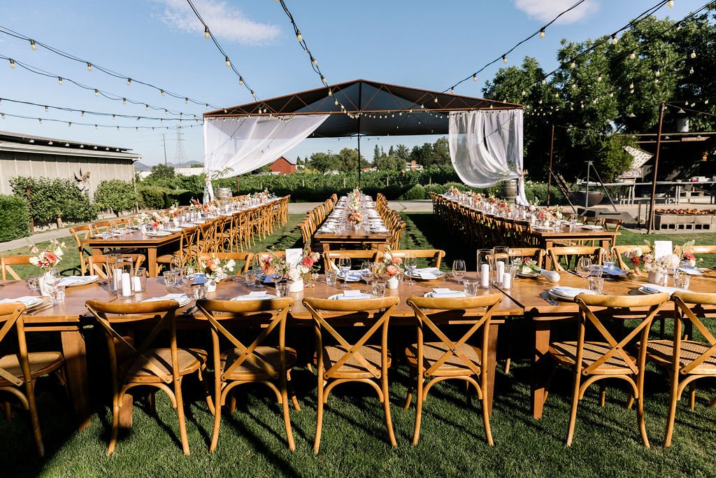 Tables at outdoor farm wedding reception in San Francisco. Image name: wedding-florist-boise-98