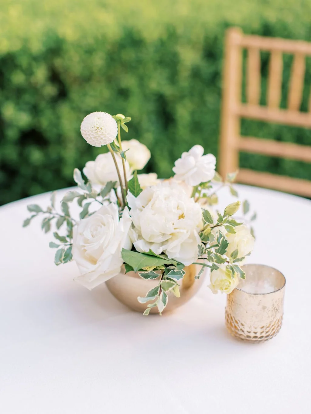 Gold vase holding white roses at San Fransico wedding. Image name: wedding-florist-boise-142