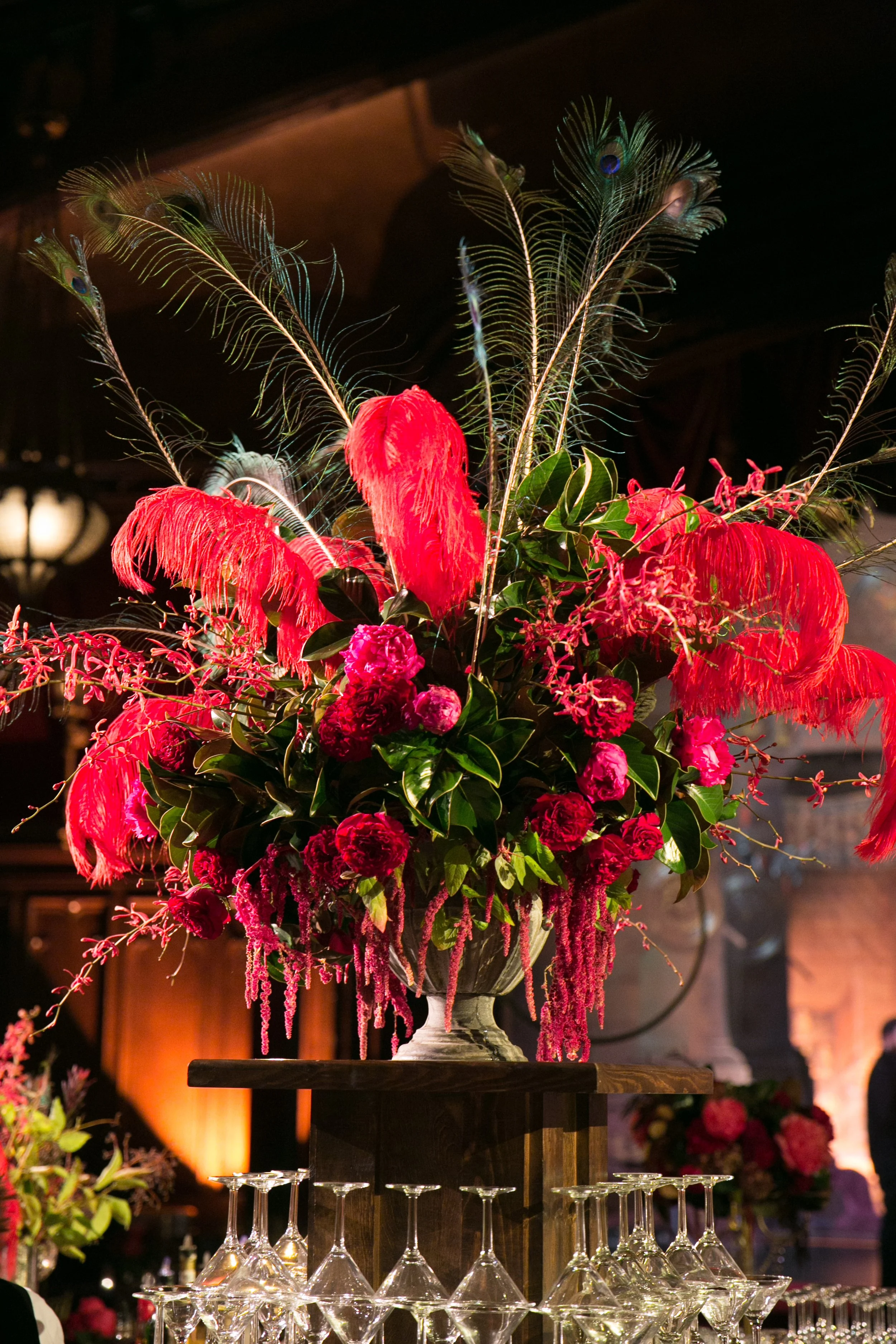 Red peonies red feathers black feathers arrangement masquerade ball San Francisco image name: corporate-florist-boise-37