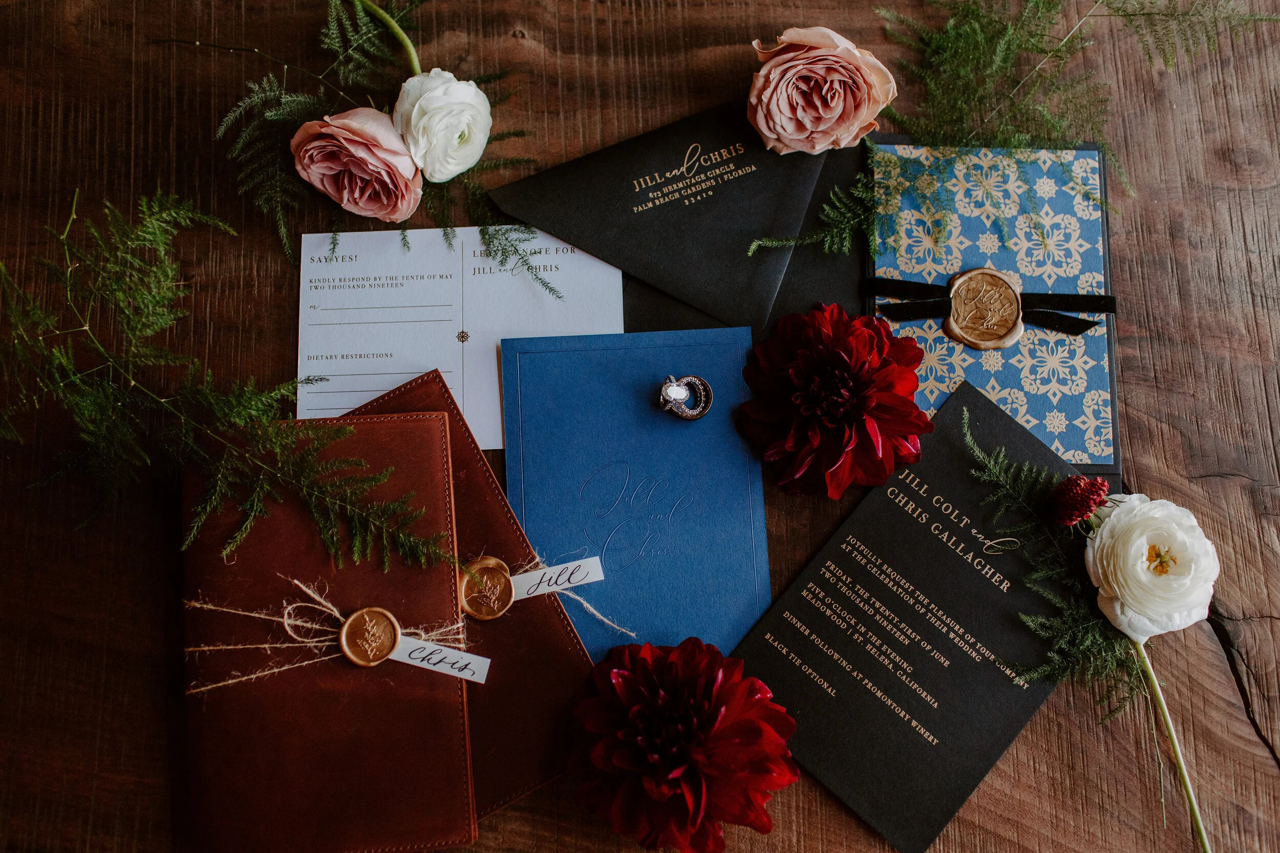 Wedding invitation suite next to blush roses wite roses burgundy dahlias image name: wedding-florist-boise-556
