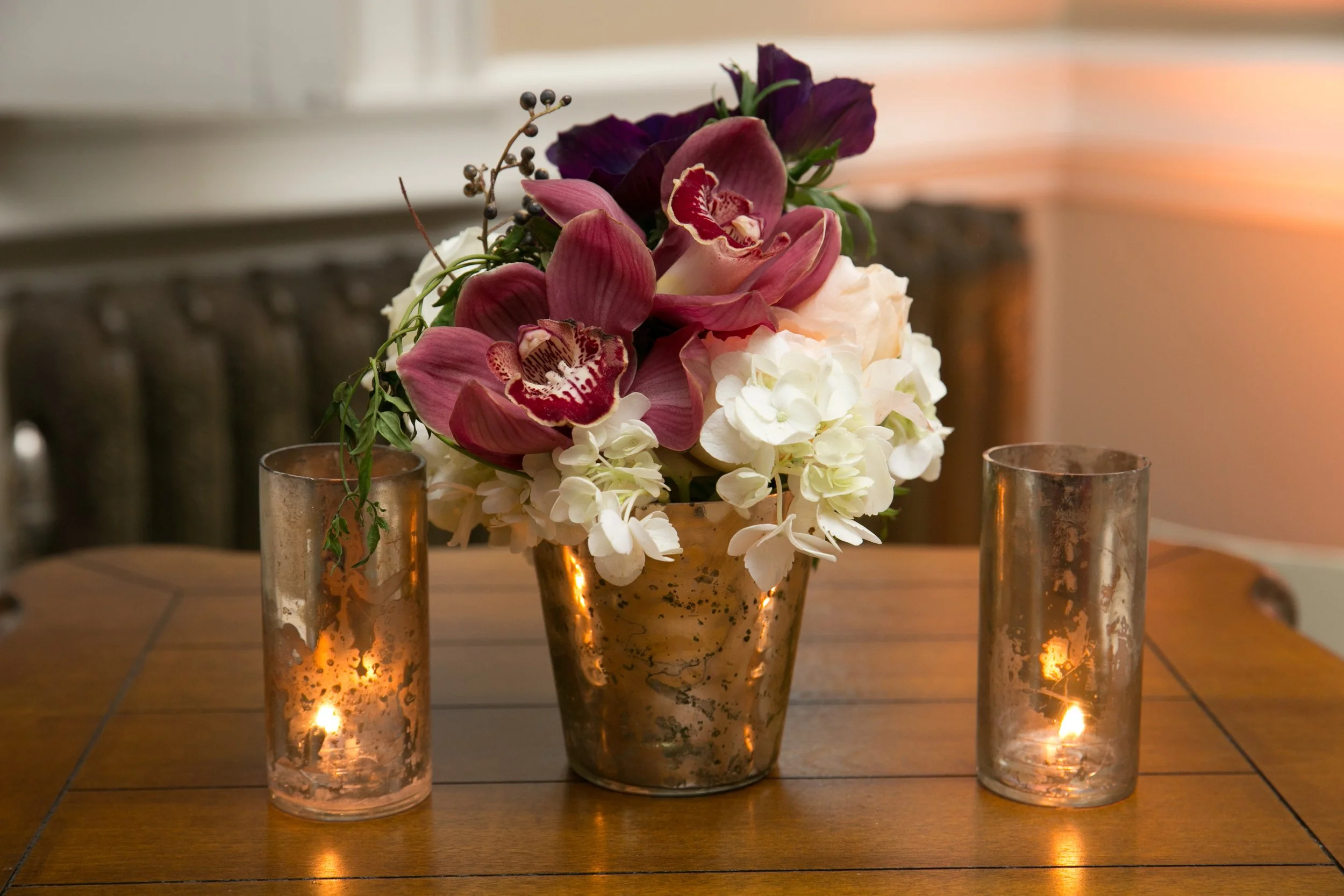 Purple orchids white sweat peas floral arrangement masquerade ball San Francisco CA image name: corporate-florist-boise-48