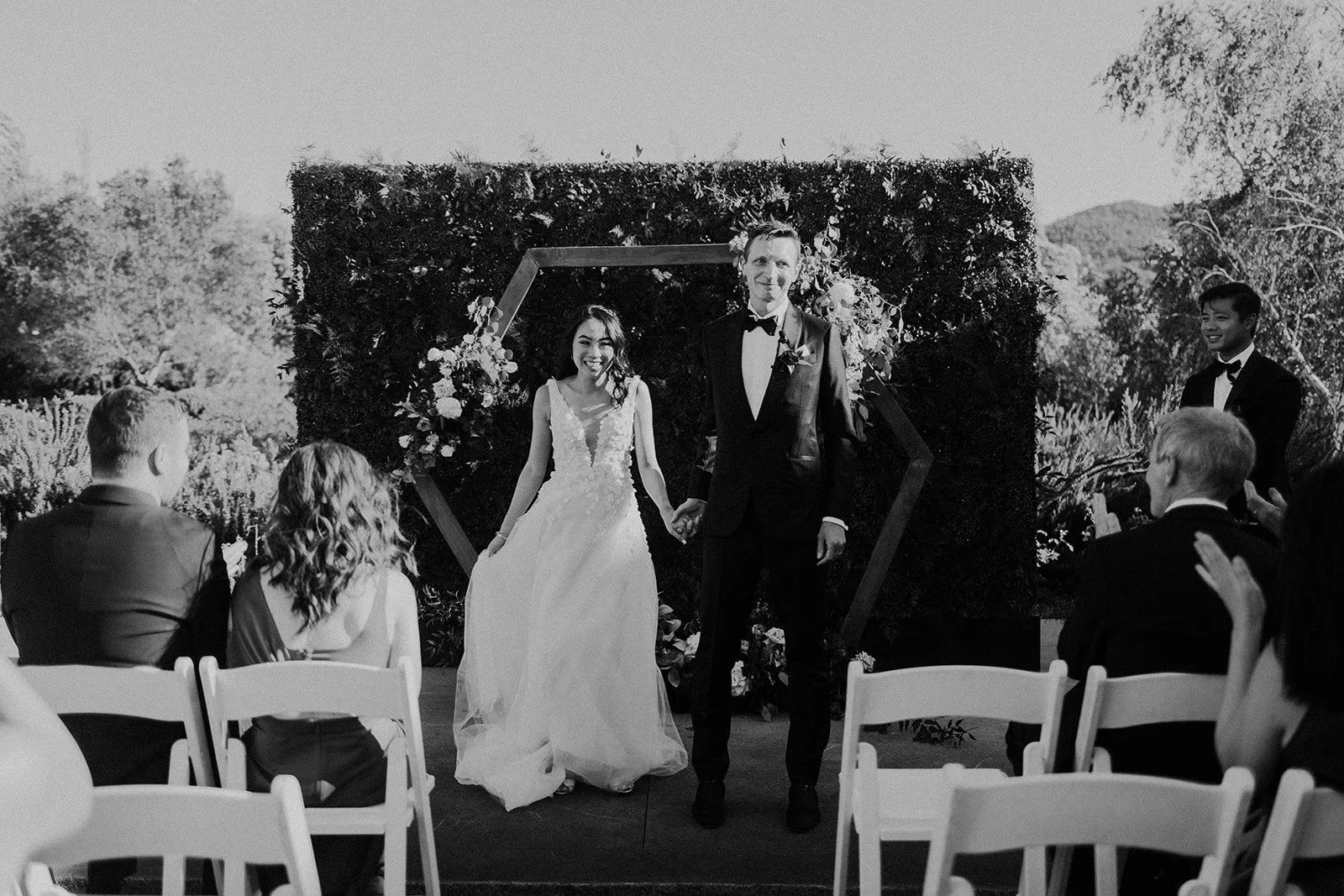 Couple standing Modern wooden hexagon alter wooden alter image name: wedding-florist-boise-205