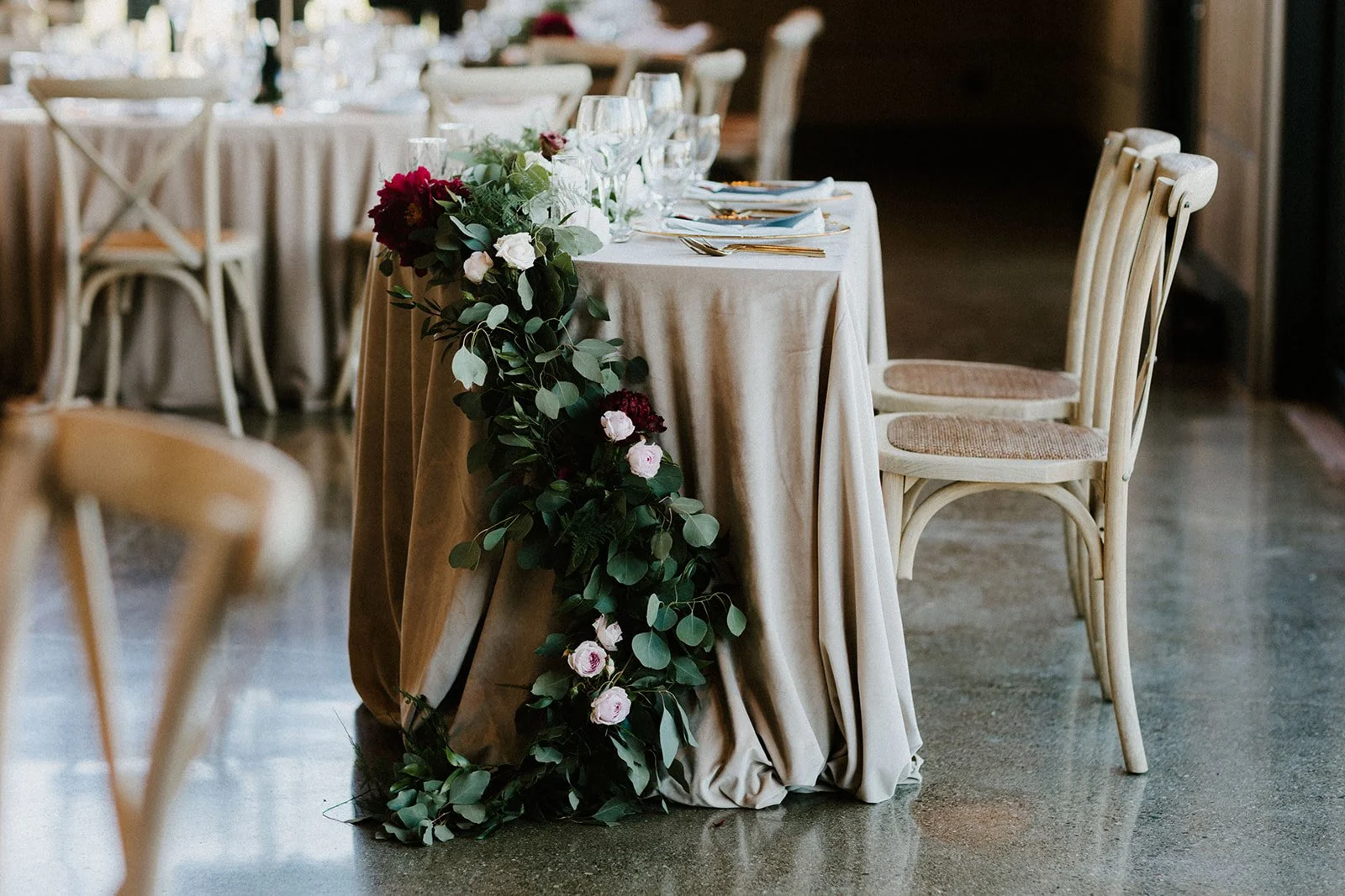 Couple's table with draping white roses green leaves image name: wedding-florist-boise-198