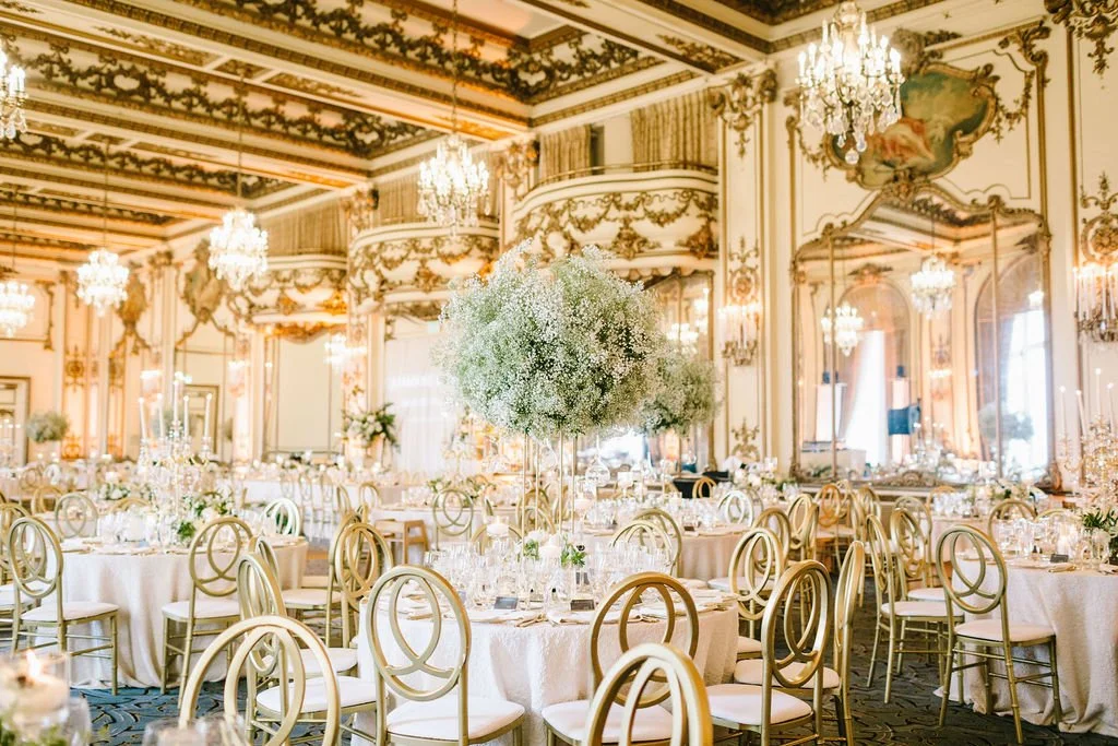 Centerpieces reception tall vases large rounds of baby's breath. Image name: wedding-florist-boise-57