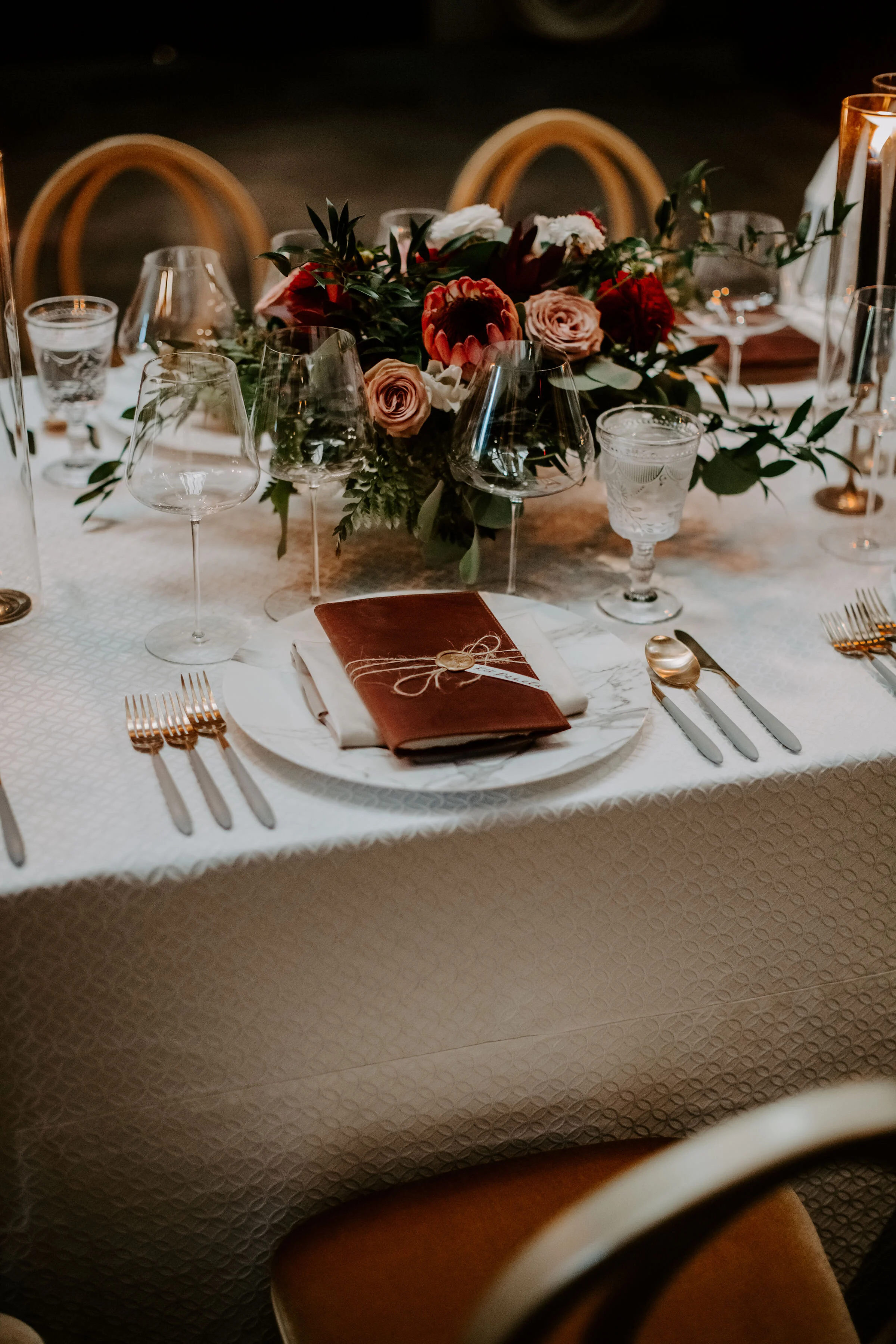 Floral arragnment protea, blush roses, white roses and burgundy dalhias image name: wedding-florist-boise-575