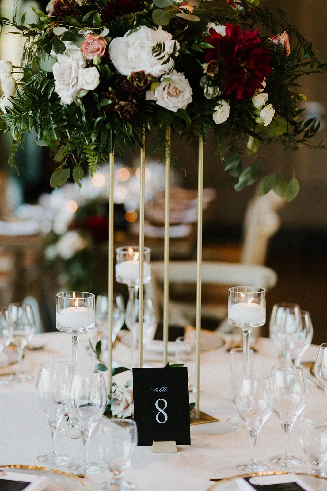 Tall table centerpiece white roses blush roses table number image name: wedding-florist-boise-206