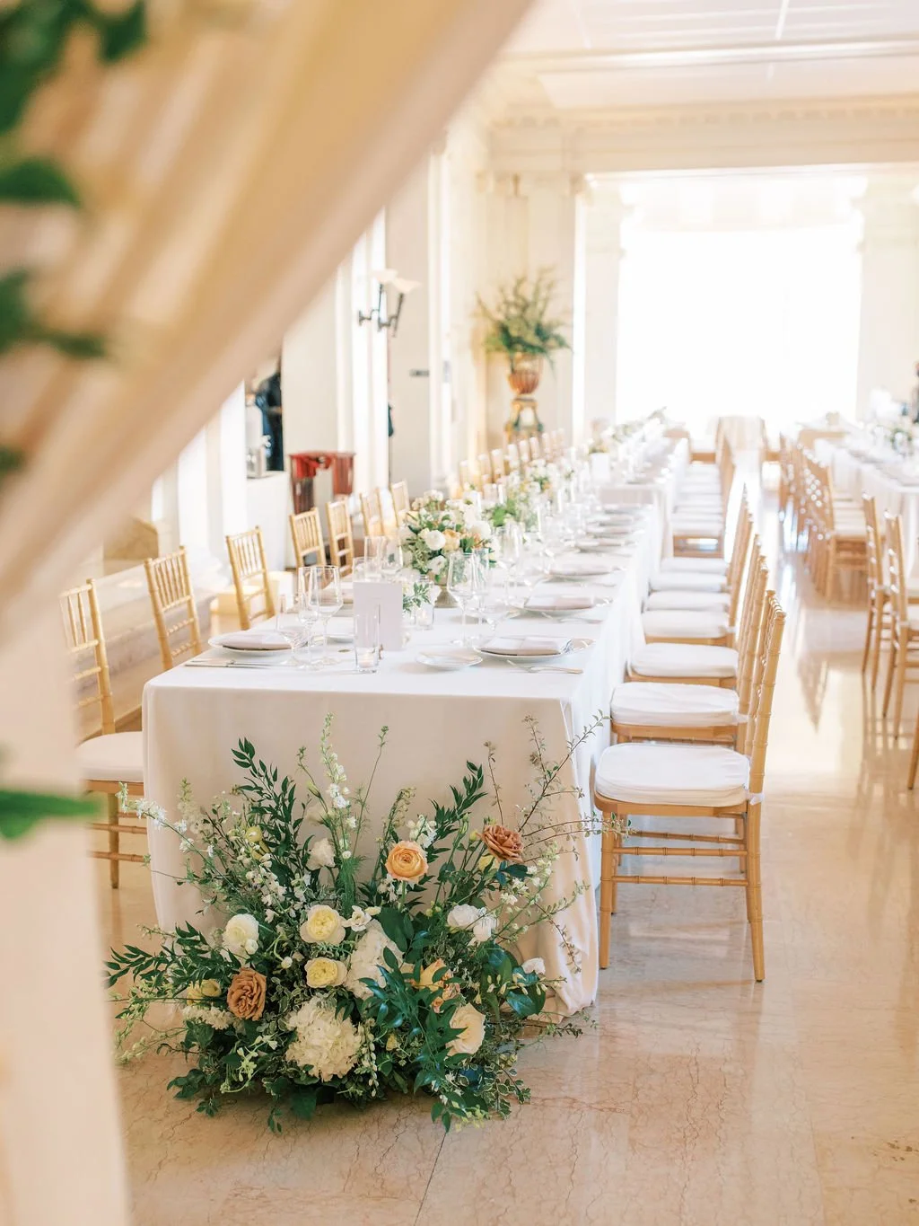 Reception hall with white roses, pink roses, white hydrangeas, yellow roses. Image name: wedding-florist-boise-146