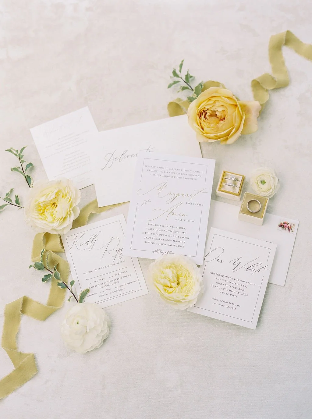 Invitations with white roses yellow roses placed around them. Image name: wedding-florist-boise-123