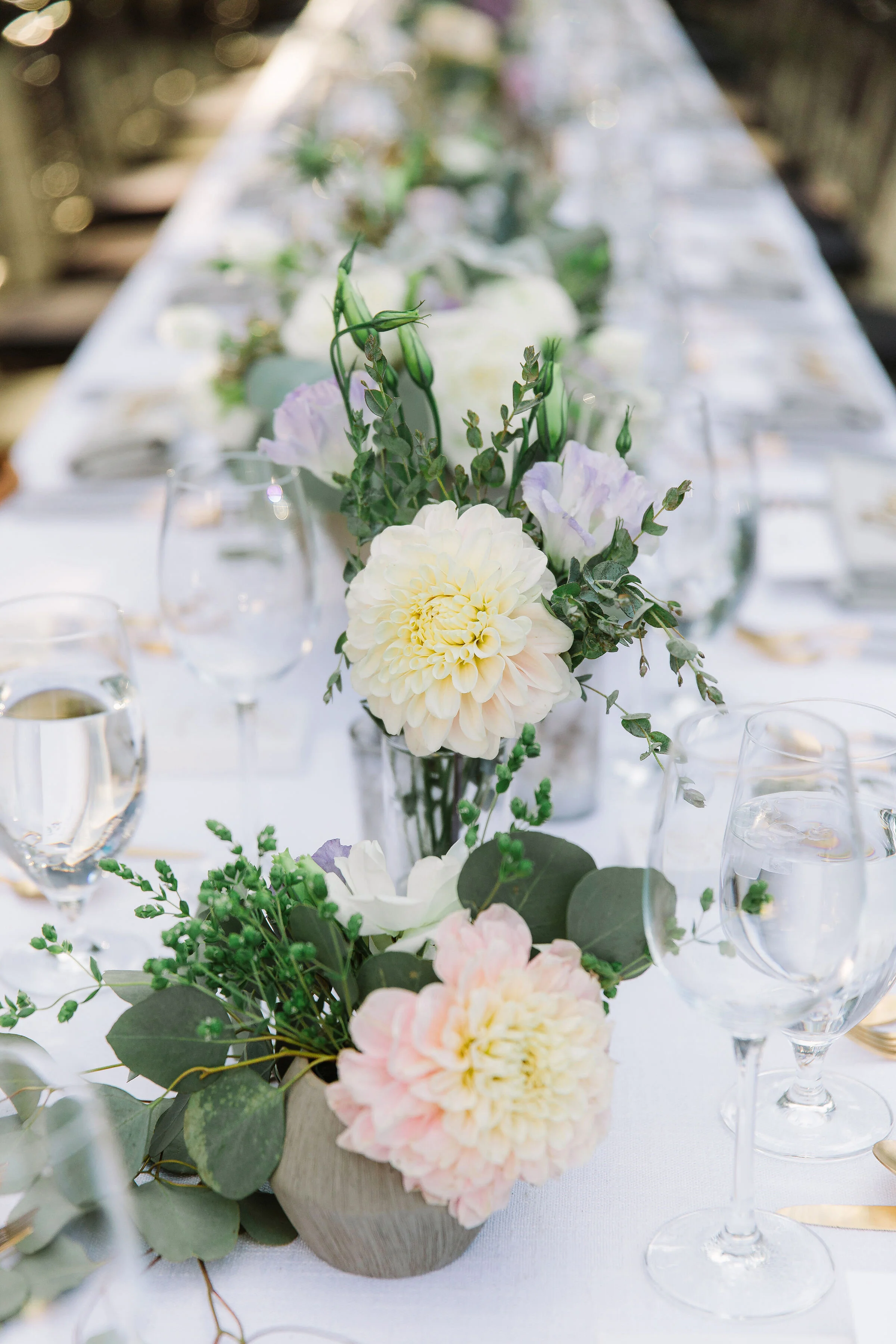 Pale pink dahlias sit on reception table for Sonoma County wedding image name: wedding-florist-boise-766